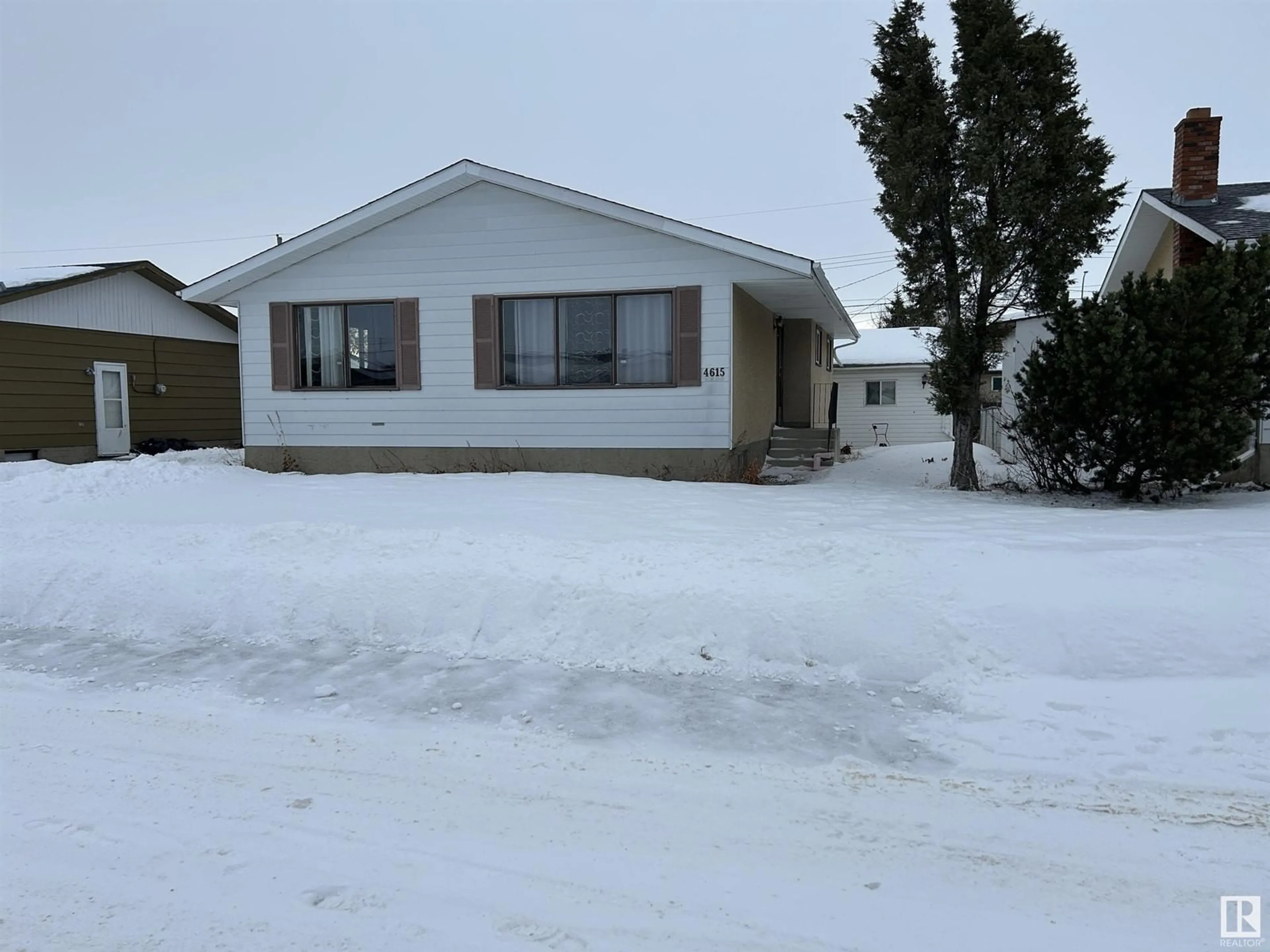 Home with vinyl exterior material, street for 4615 49 AV, Redwater Alberta T0A2W0