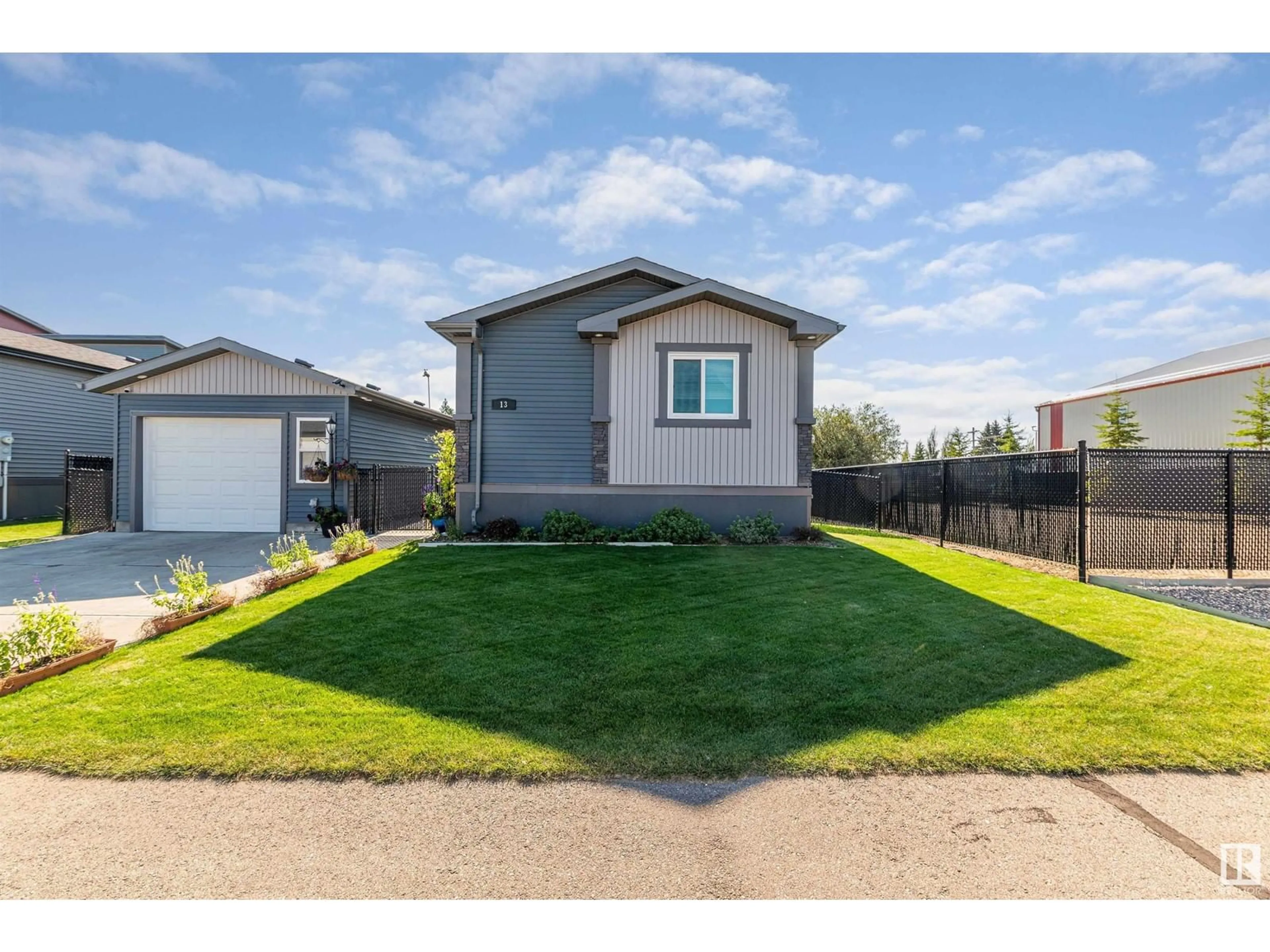 Home with vinyl exterior material, street for 13 Laurel DR, Morinville Alberta T8R2P7