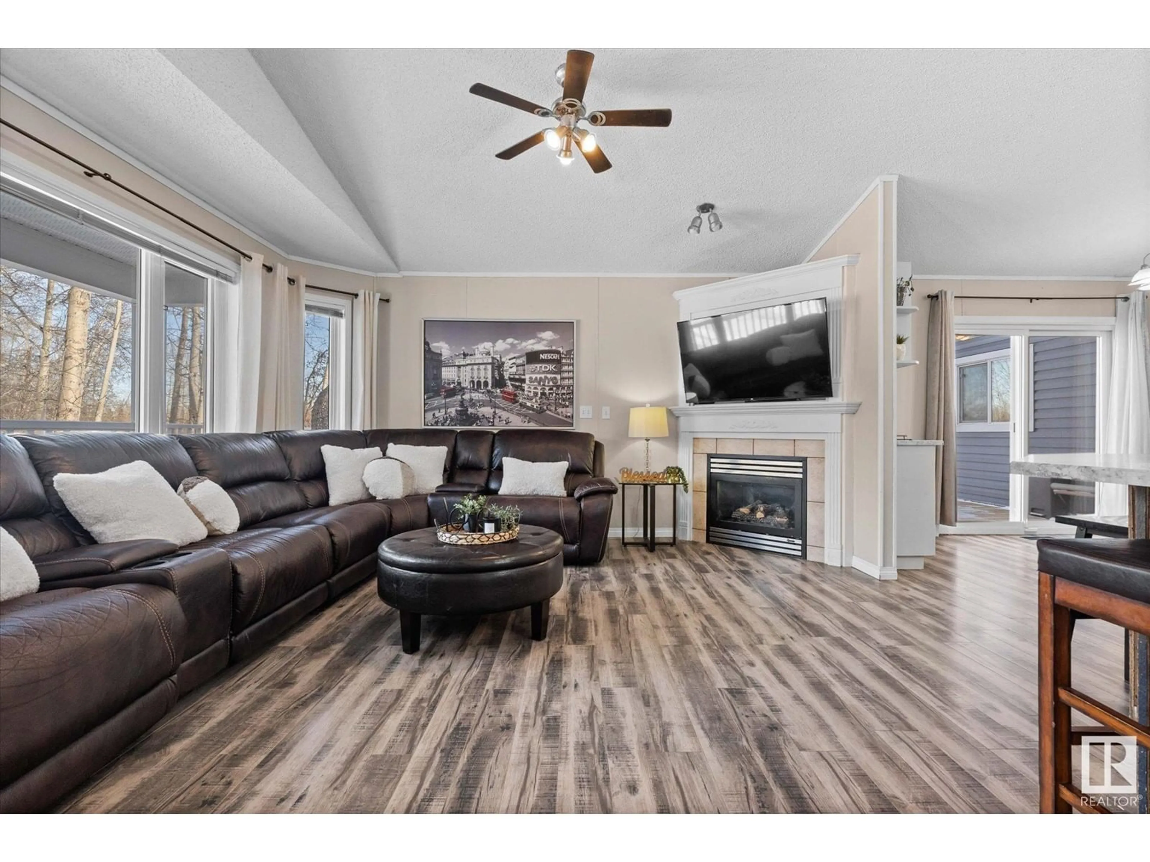 Living room with furniture, wood/laminate floor for 84 5124 TWP RD 554, Rural Lac Ste. Anne County Alberta T0E0J0