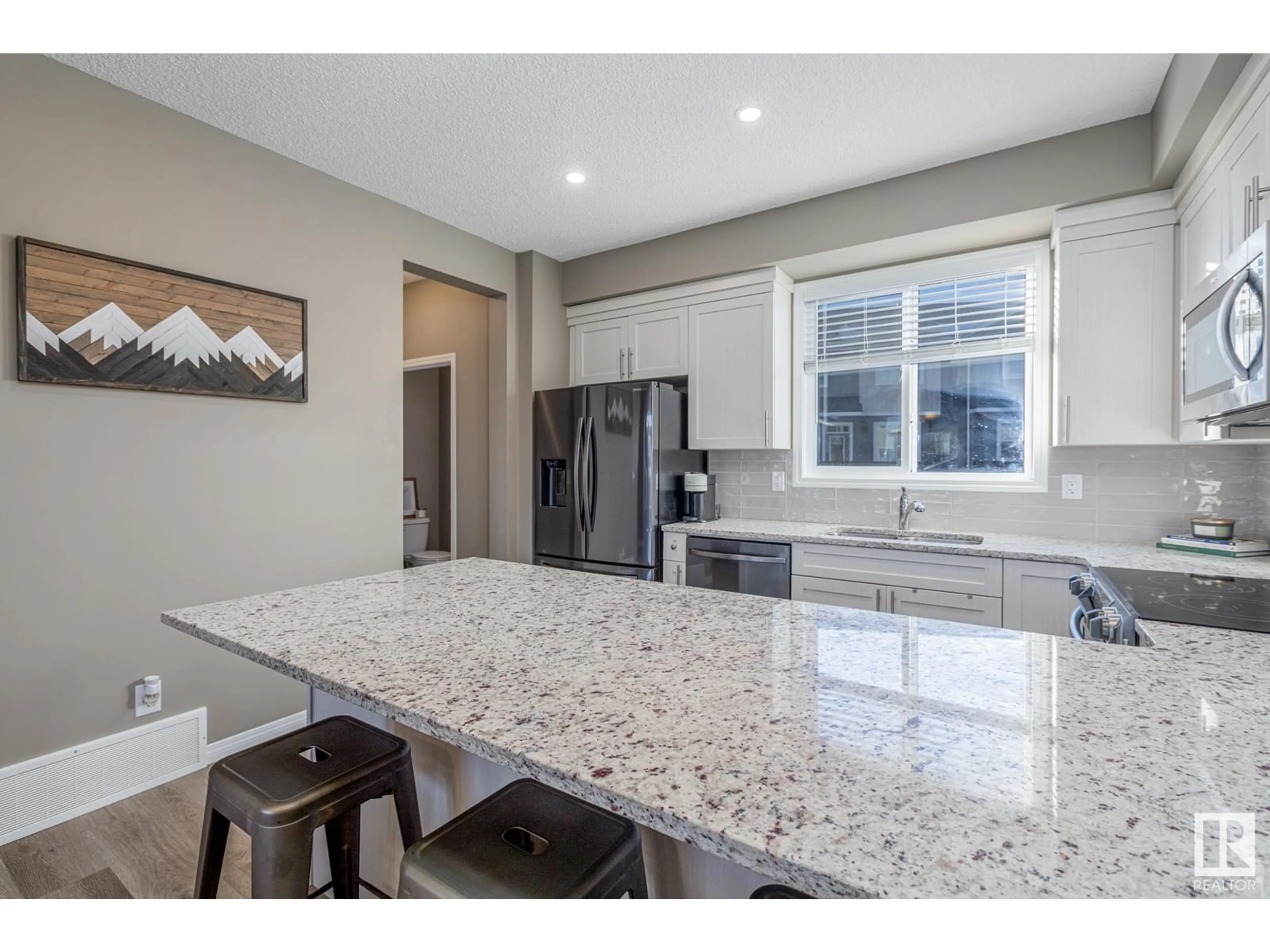 Open concept kitchen, ceramic/tile floor for 2096 Wonnacott WY SW, Edmonton Alberta T6X2V7