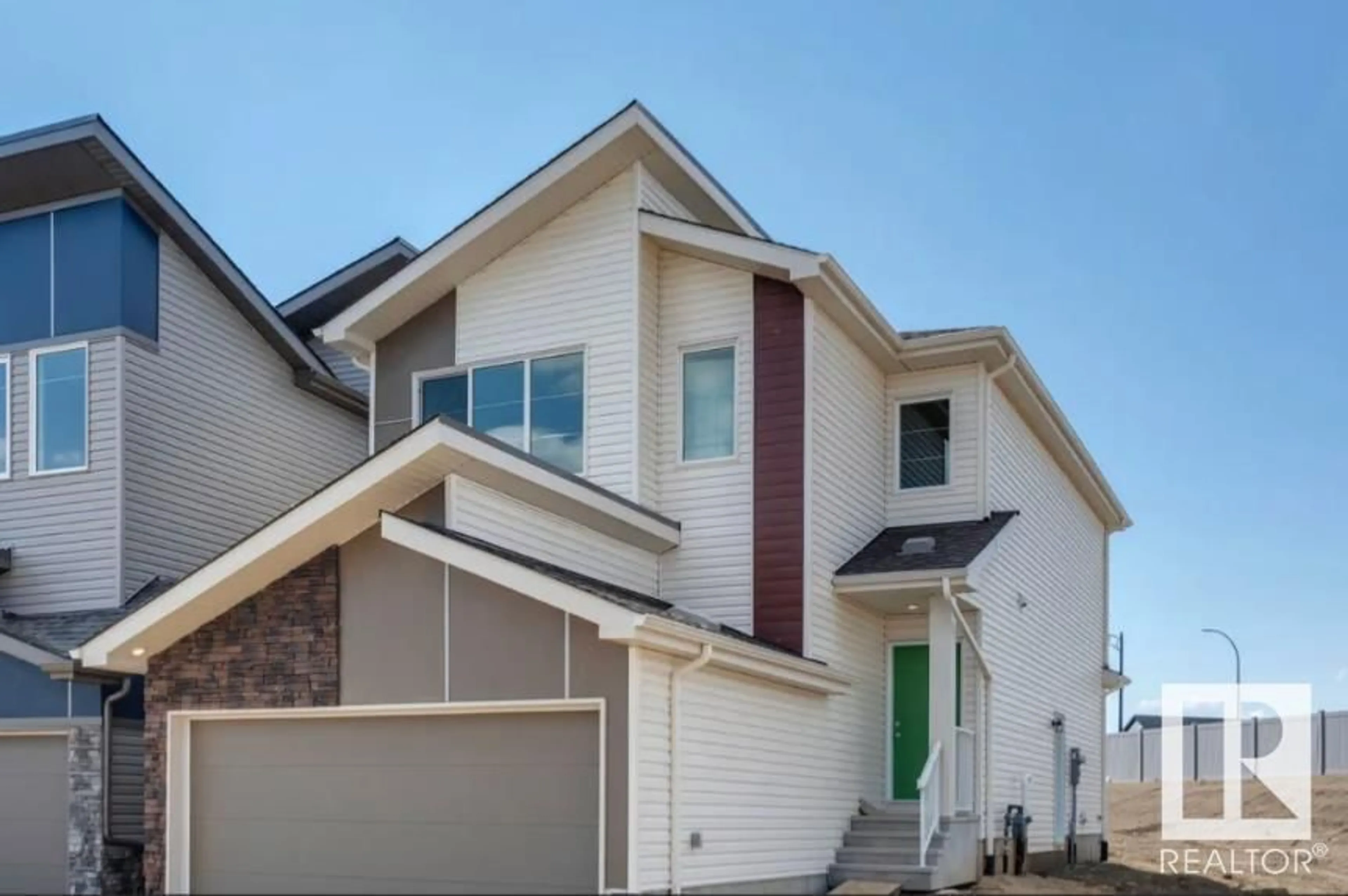 Home with vinyl exterior material, street for 19315 24 AV NW, Edmonton Alberta T5K0K5