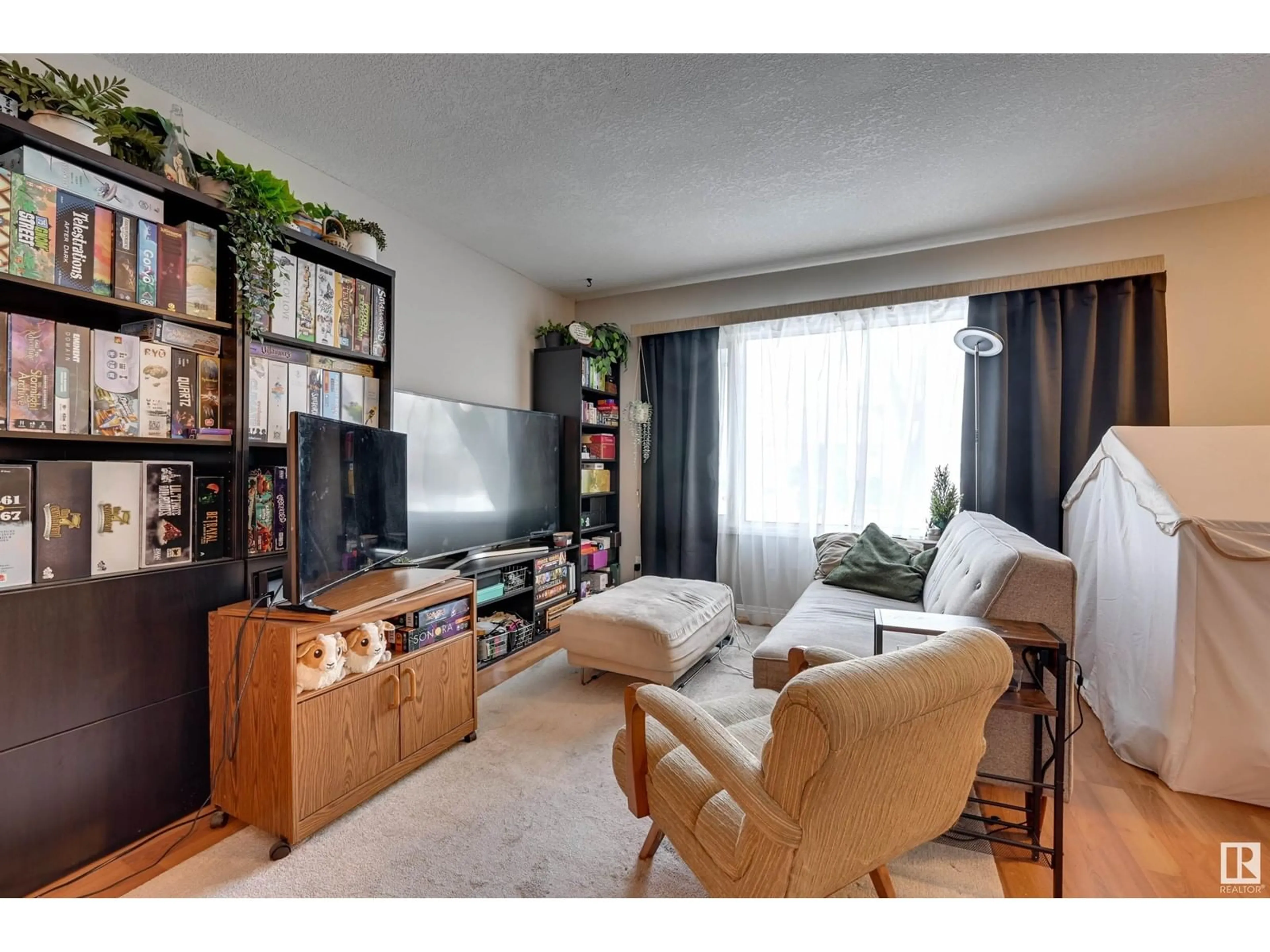 Living room with furniture, unknown for 12029 104 ST NW, Edmonton Alberta T5G2L5