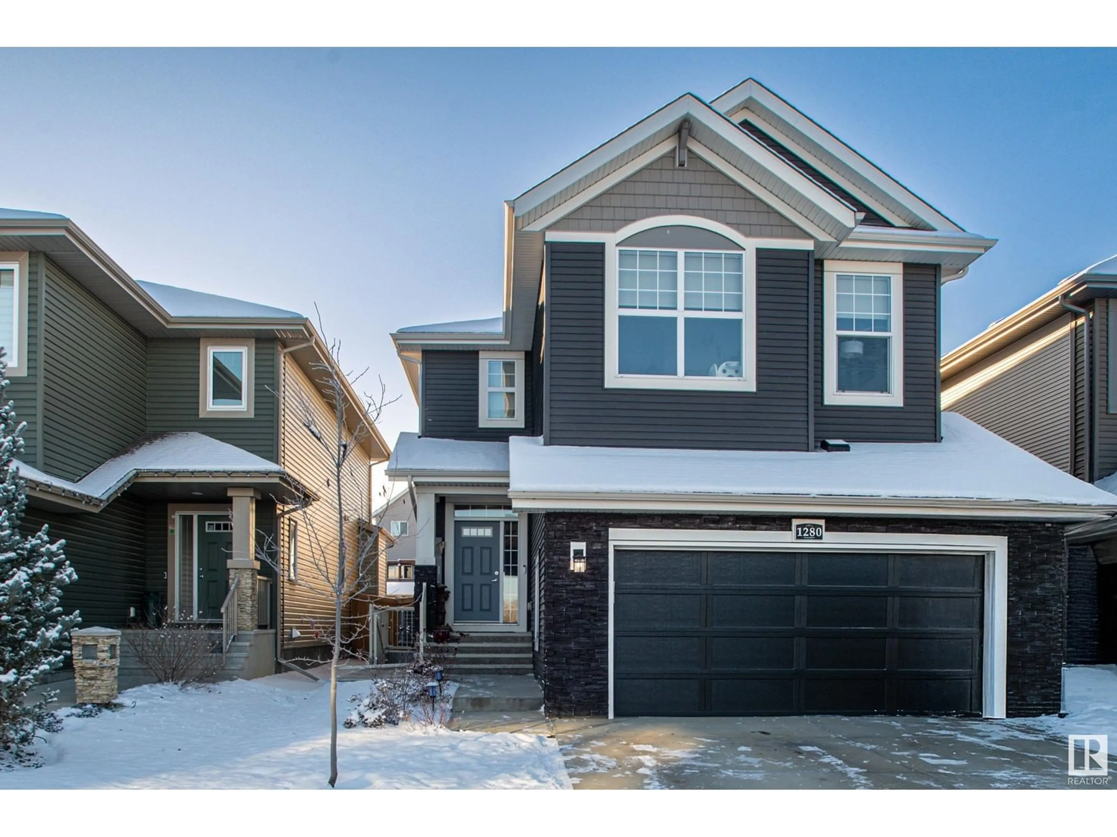 Home with vinyl exterior material, street for 1280 Peregrine TC NW, Edmonton Alberta T5S0M4