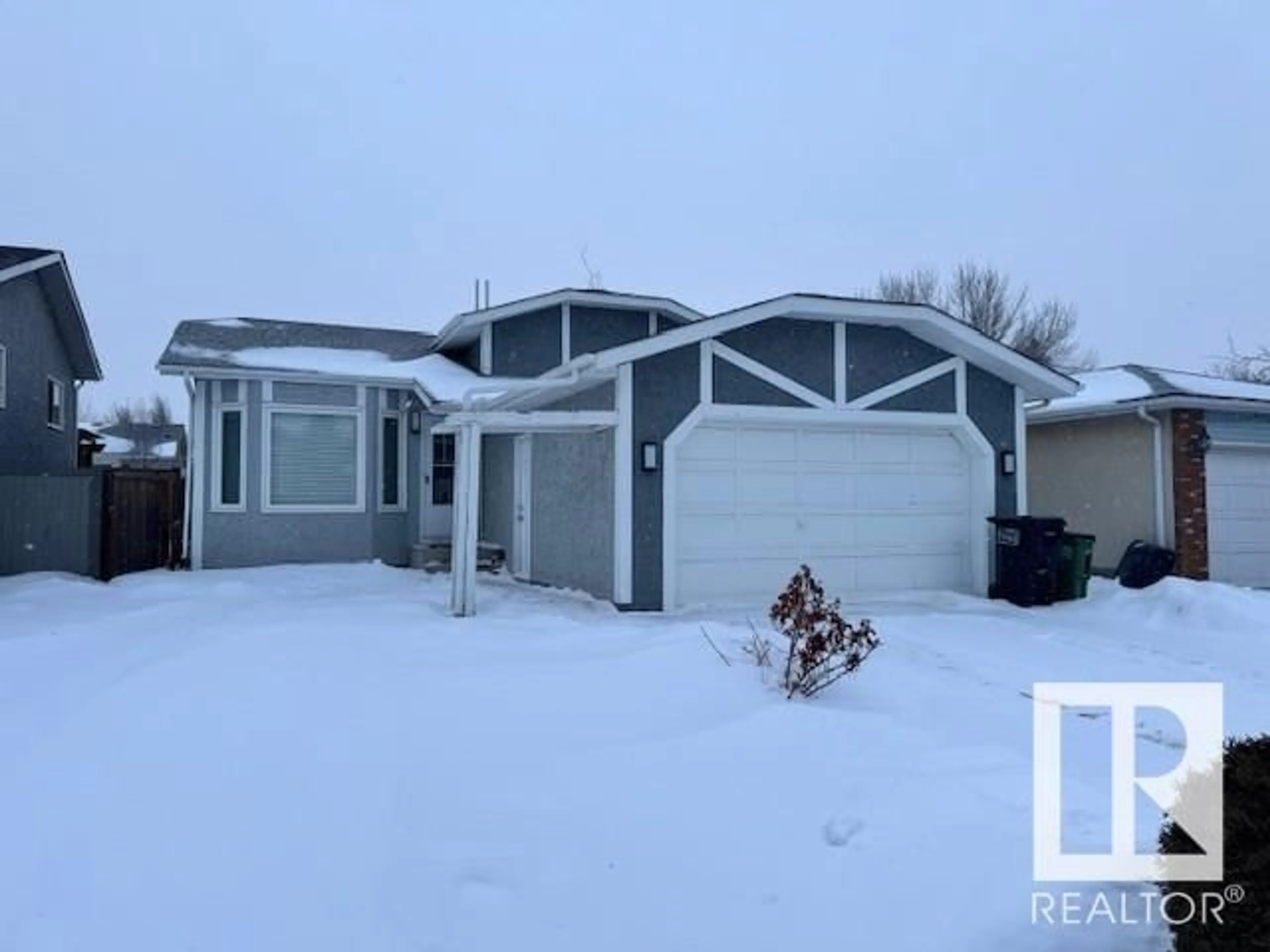 Home with vinyl exterior material, street for 7108 190 ST NW, Edmonton Alberta T5T5S3