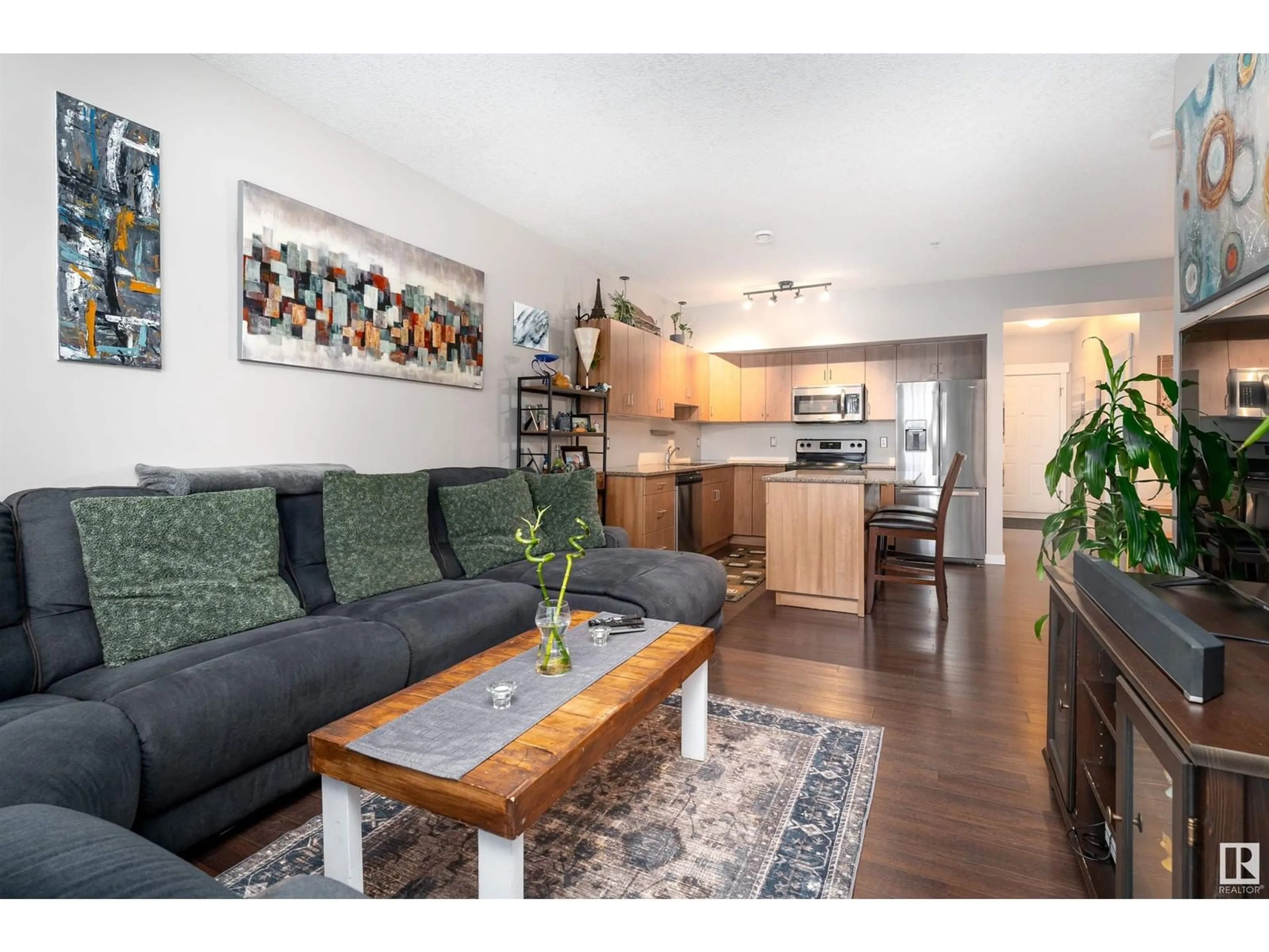 Living room with furniture, wood/laminate floor for #409 10518 113 ST NW, Edmonton Alberta T5H0C6