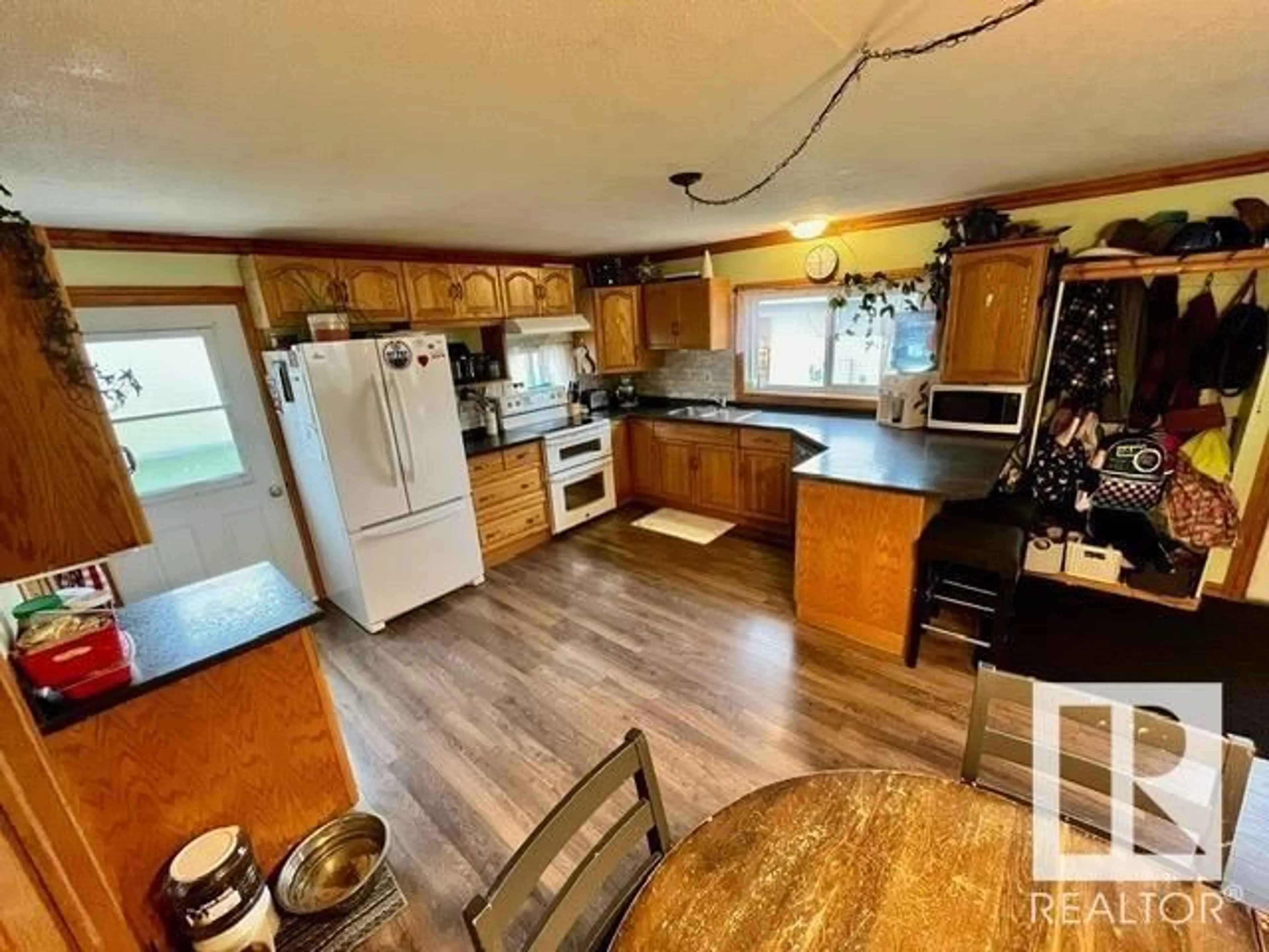 Open concept kitchen, wood/laminate floor for 5320 Pyrogy DR, Glendon Alberta T0A1P0