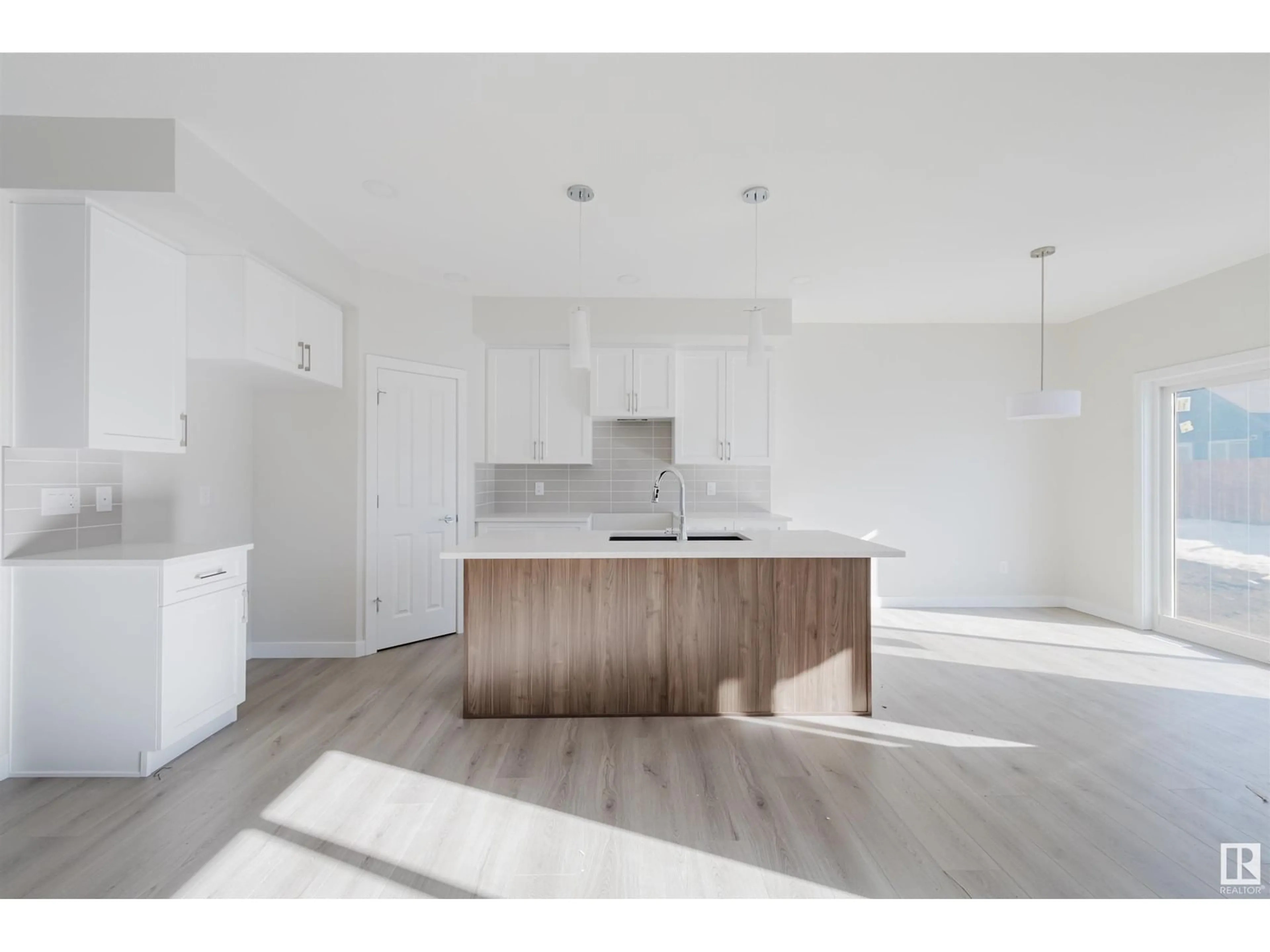 Open concept kitchen, wood/laminate floor for 73 PENN PL, Spruce Grove Alberta T7X2W7