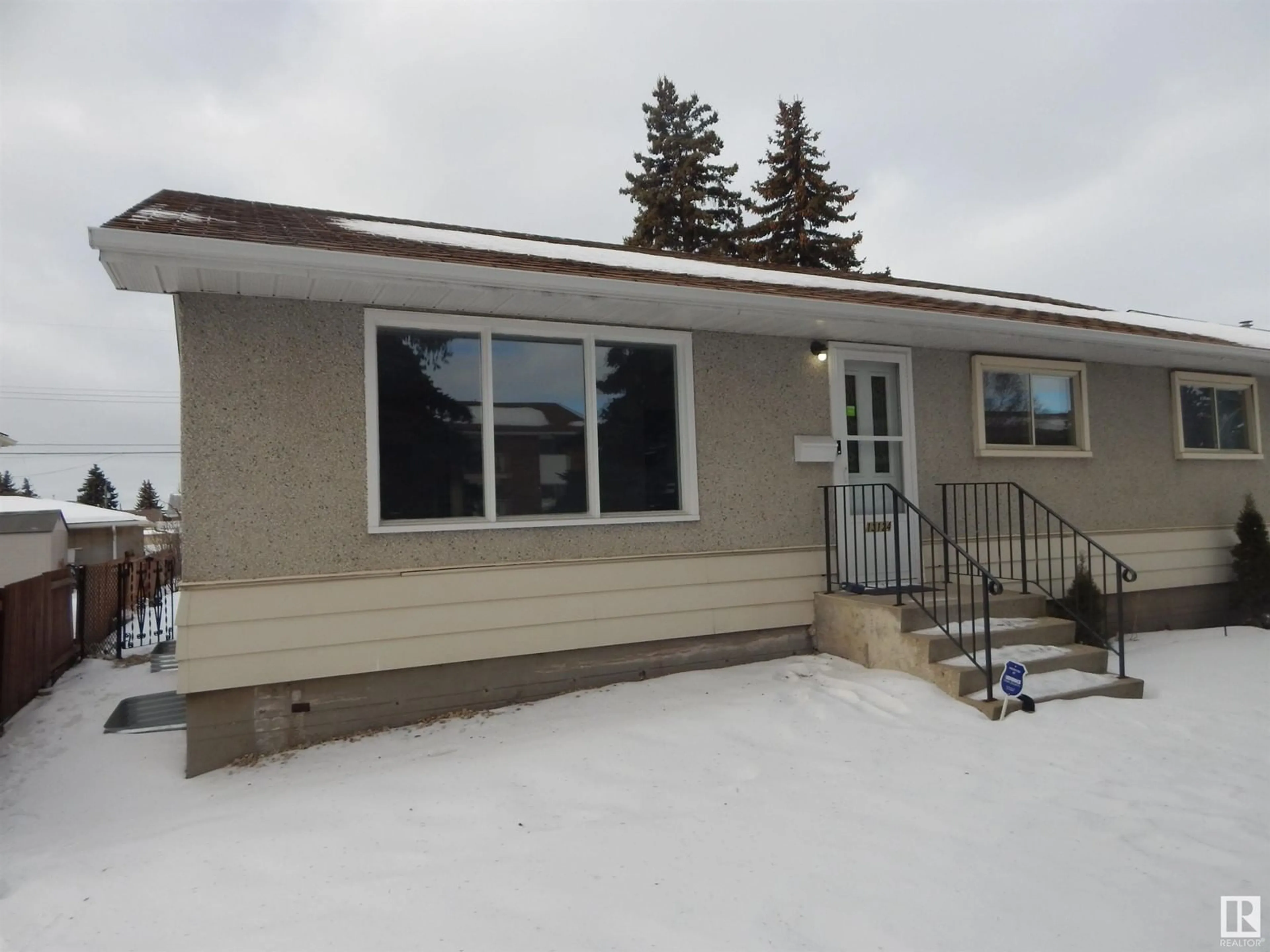 Home with vinyl exterior material, street for 13124 83 ST NW, Edmonton Alberta T5E2W6