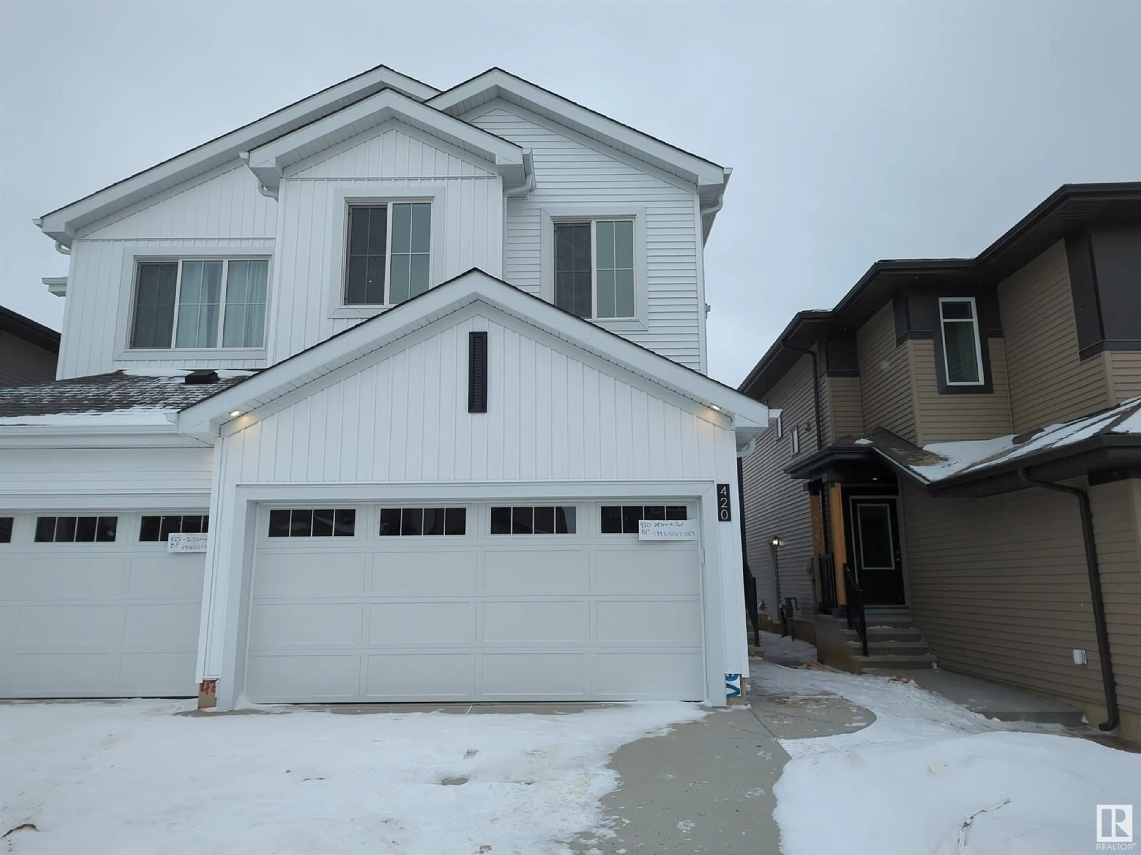 Home with vinyl exterior material, street for 420 28 ST SW, Edmonton Alberta T6X1A7