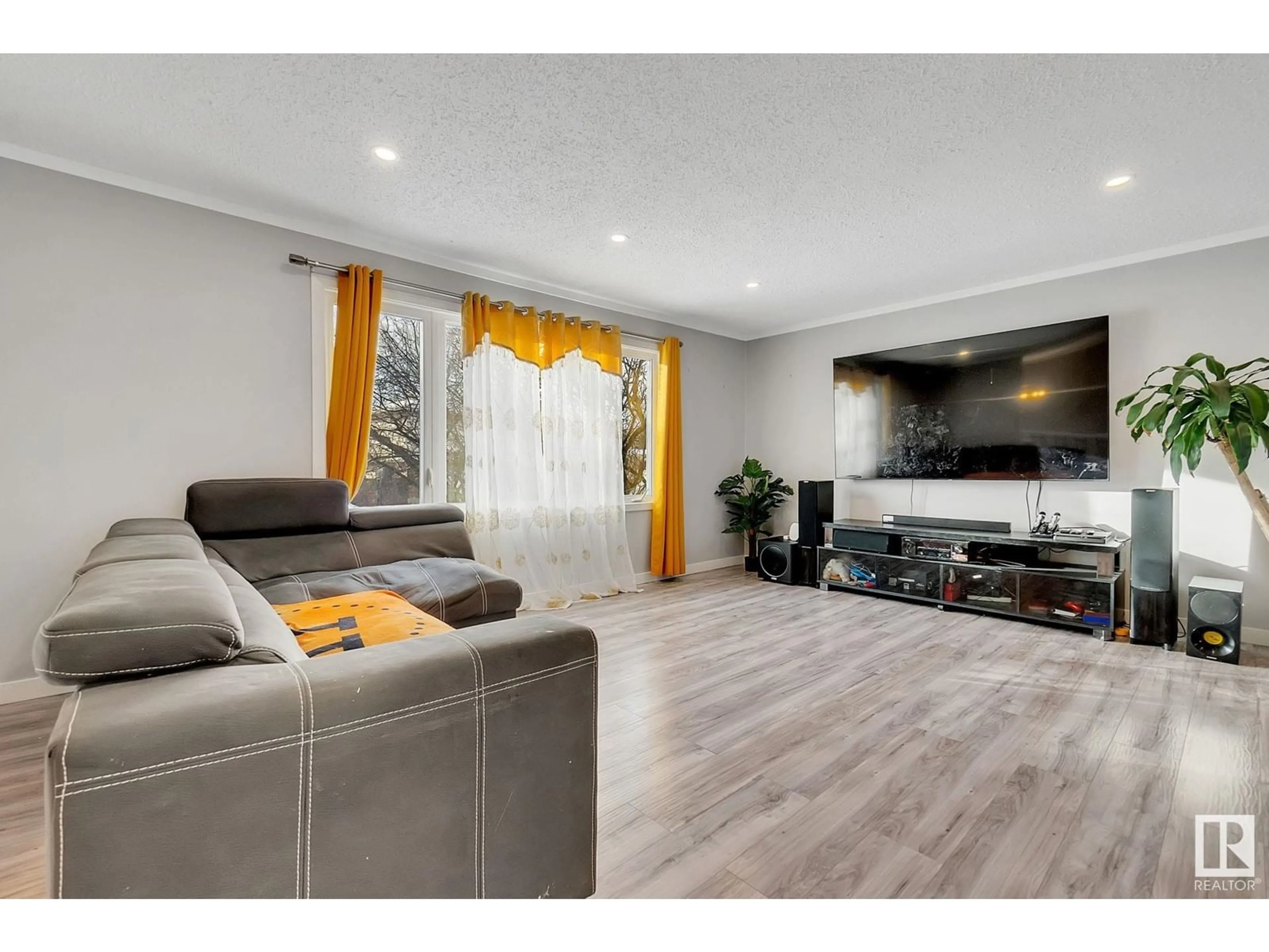 Living room with furniture, wood/laminate floor for 18012 84 AV NW, Edmonton Alberta T5T0R6