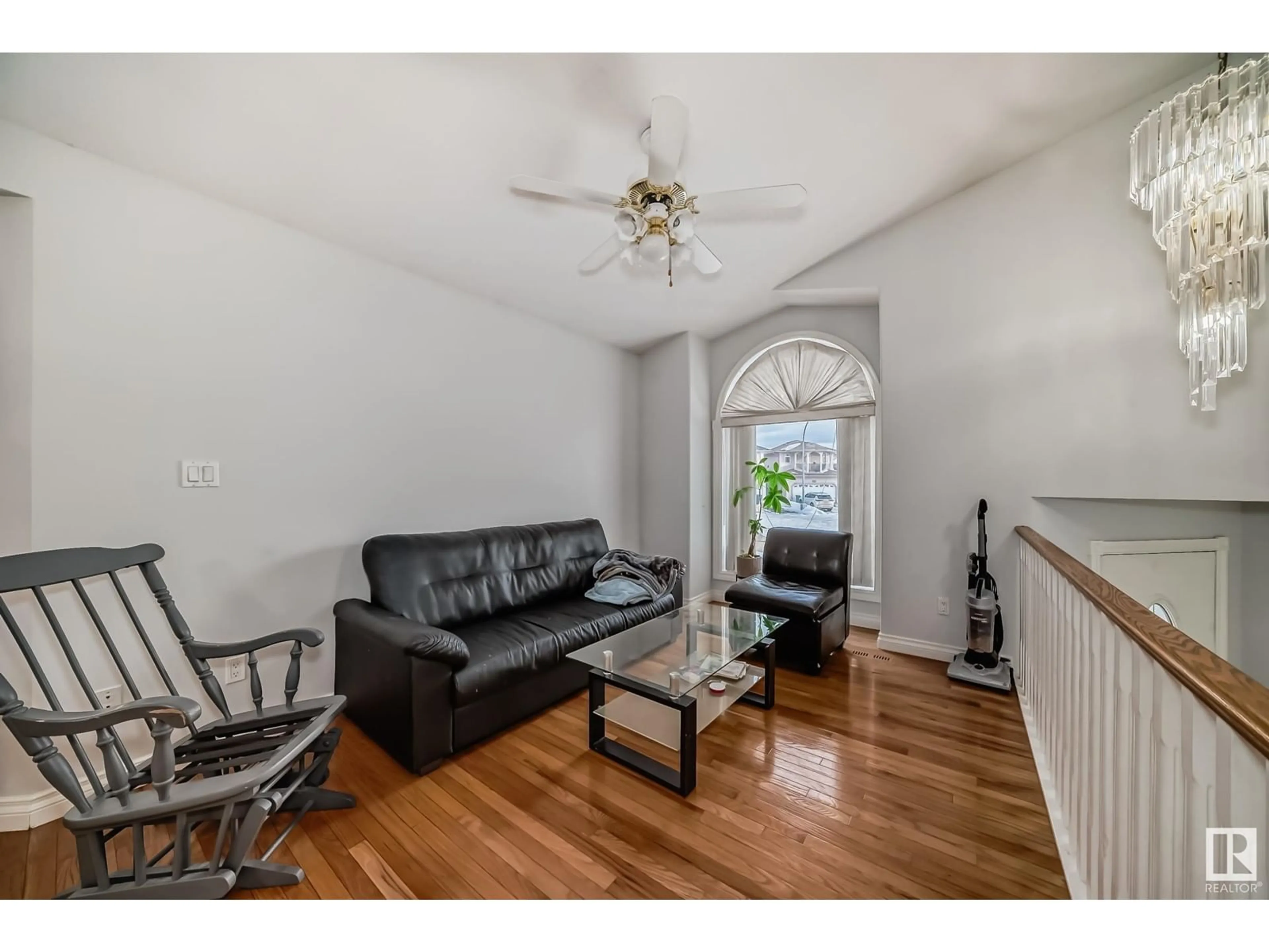 Living room with furniture, wood/laminate floor for 4126 33A AV NW, Edmonton Alberta T6L7G3