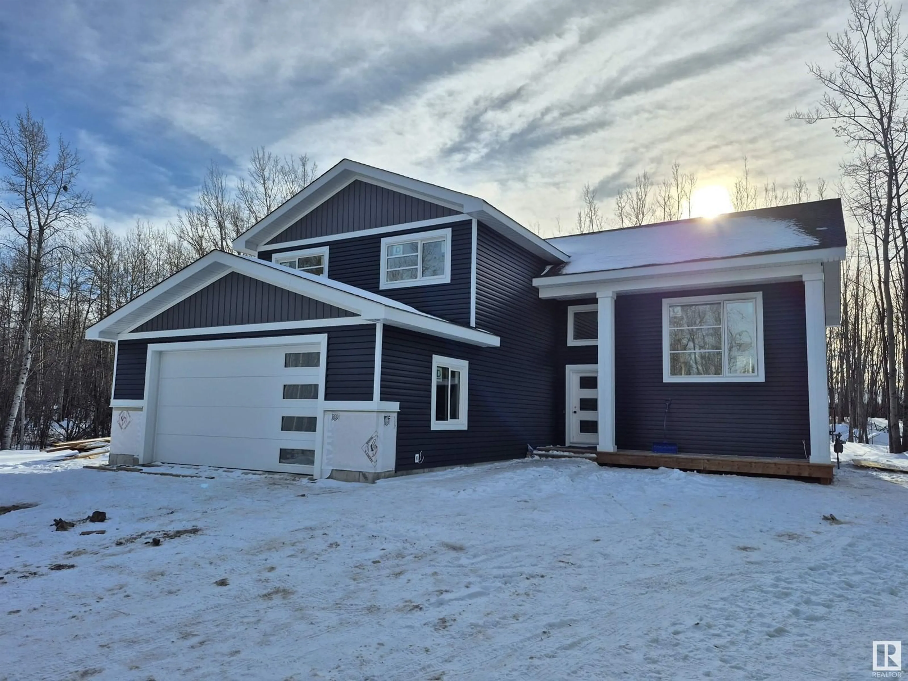 Home with vinyl exterior material, street for #29C 54228 RANGE ROAD 12, Rural Lac Ste. Anne County Alberta T0E1V2