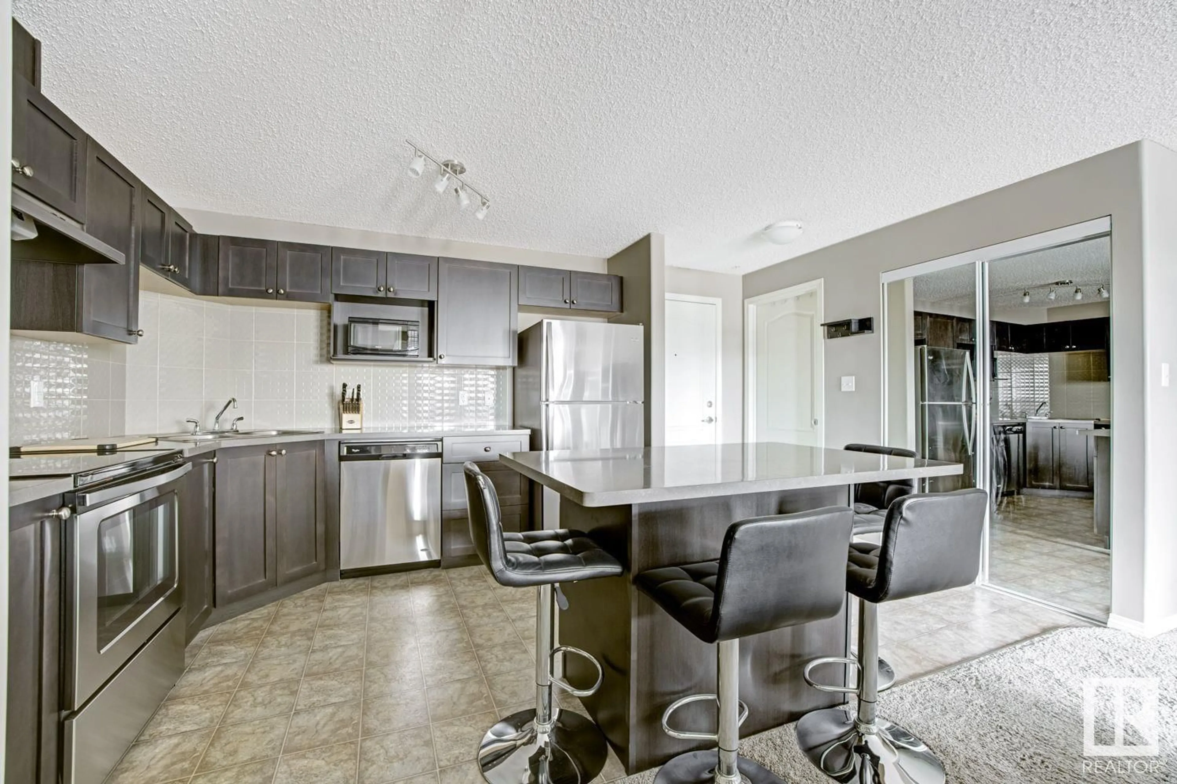 Open concept kitchen, unknown for #201 1520 HAMMOND GA NW, Edmonton Alberta T6M0J4