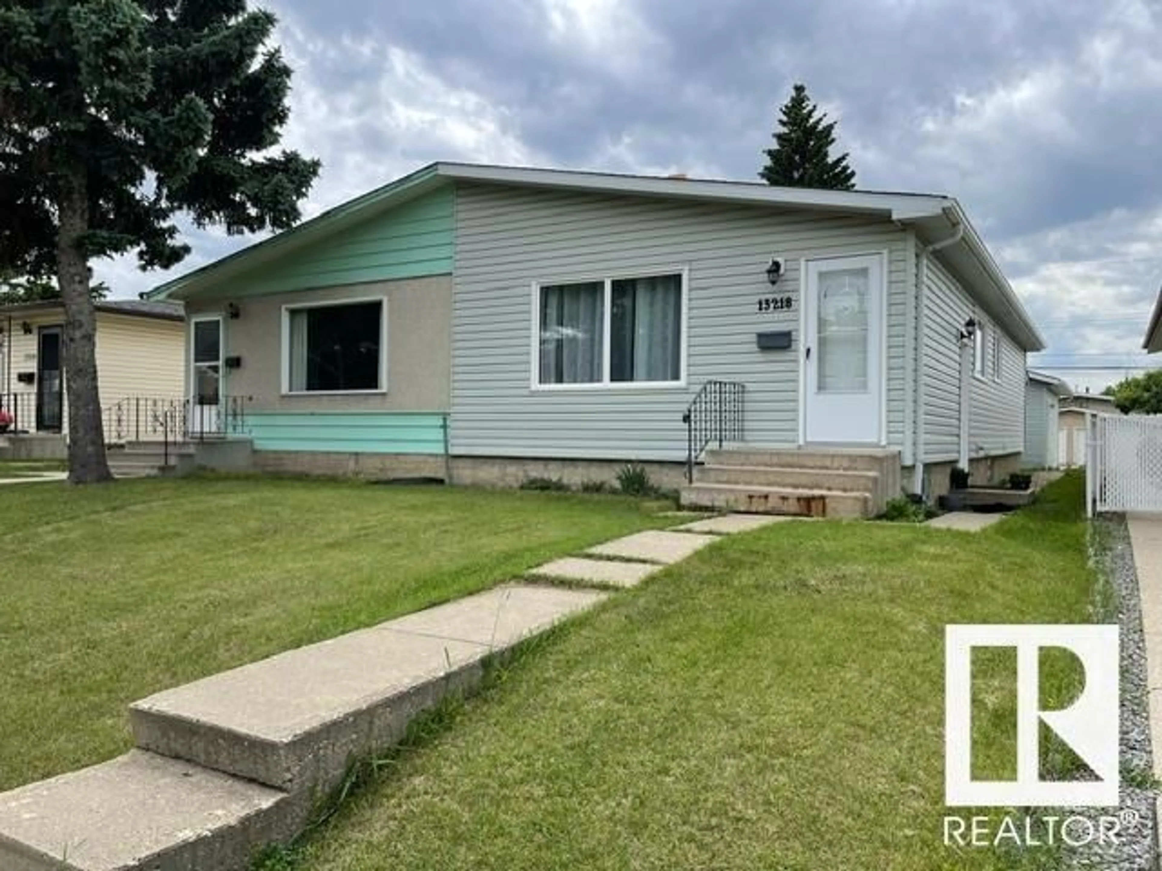 Home with vinyl exterior material, street for 13218 81 ST NW, Edmonton Alberta T5C1N7