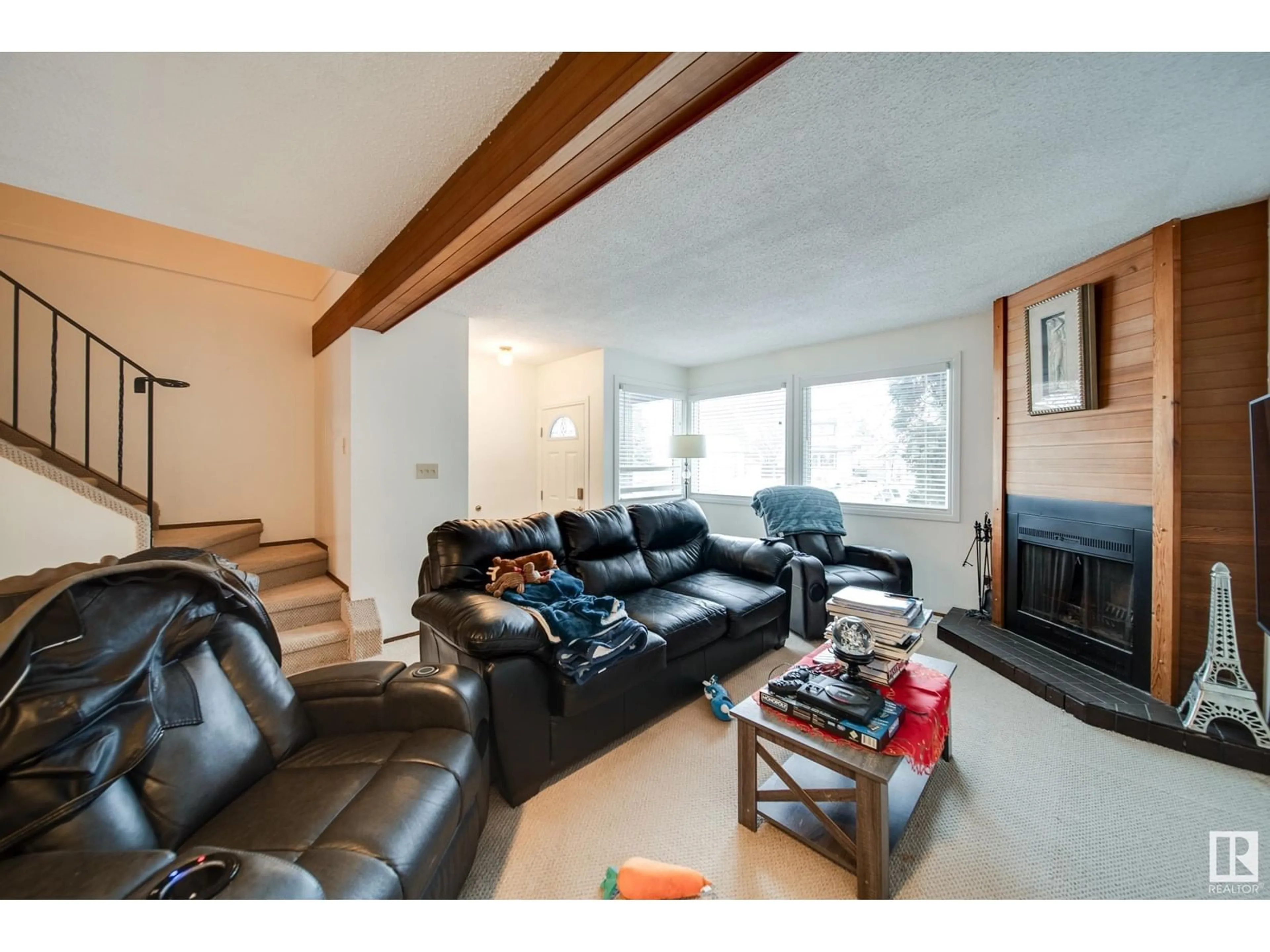 Living room with furniture, wood/laminate floor for 3512 42 AV NW, Edmonton Alberta T6L5C8