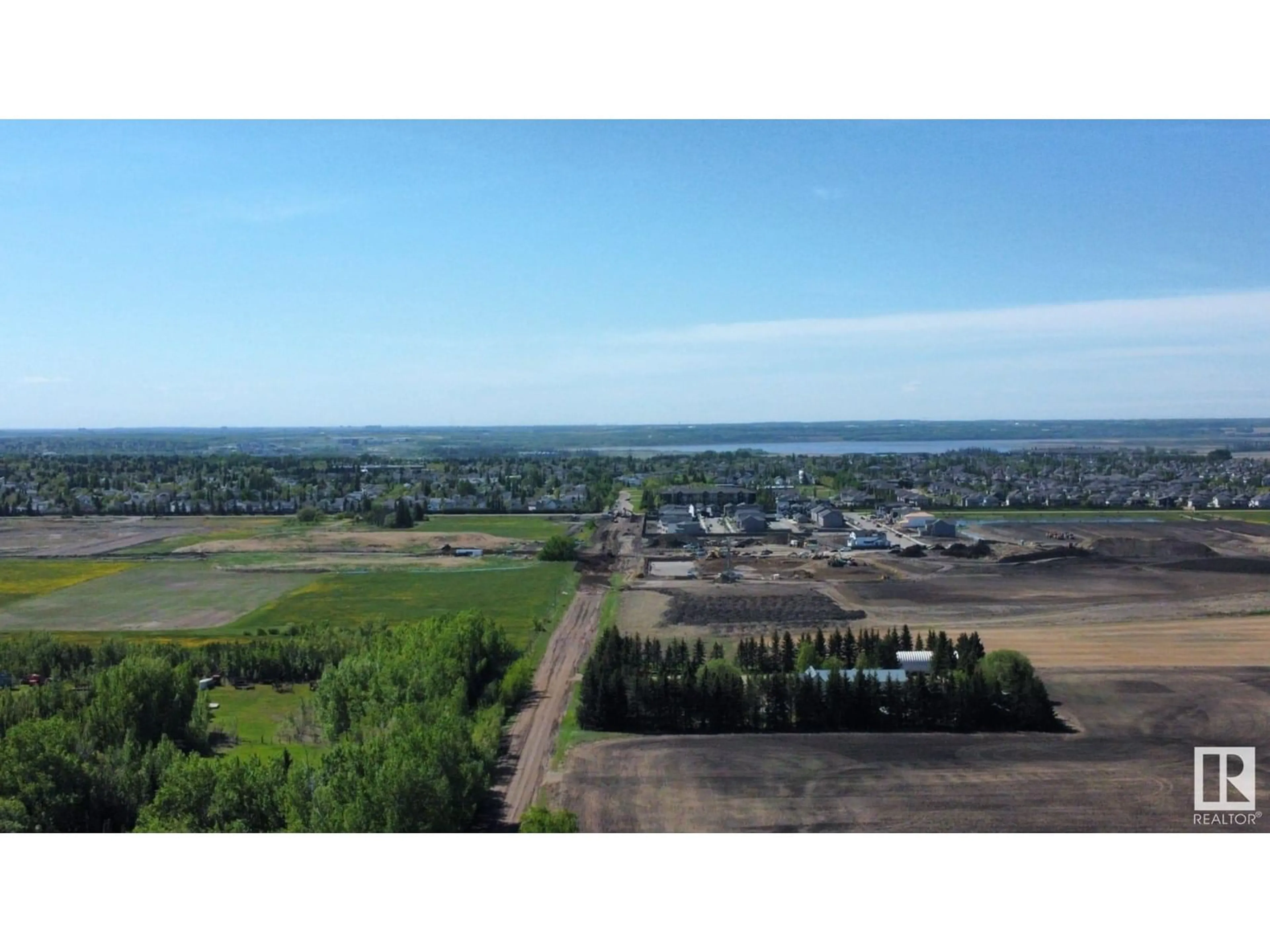 A pic from outside/outdoor area/front of a property/back of a property/a pic from drone, water/lake/river/ocean view for 54230 RR 255, St. Albert Alberta T8T0T6