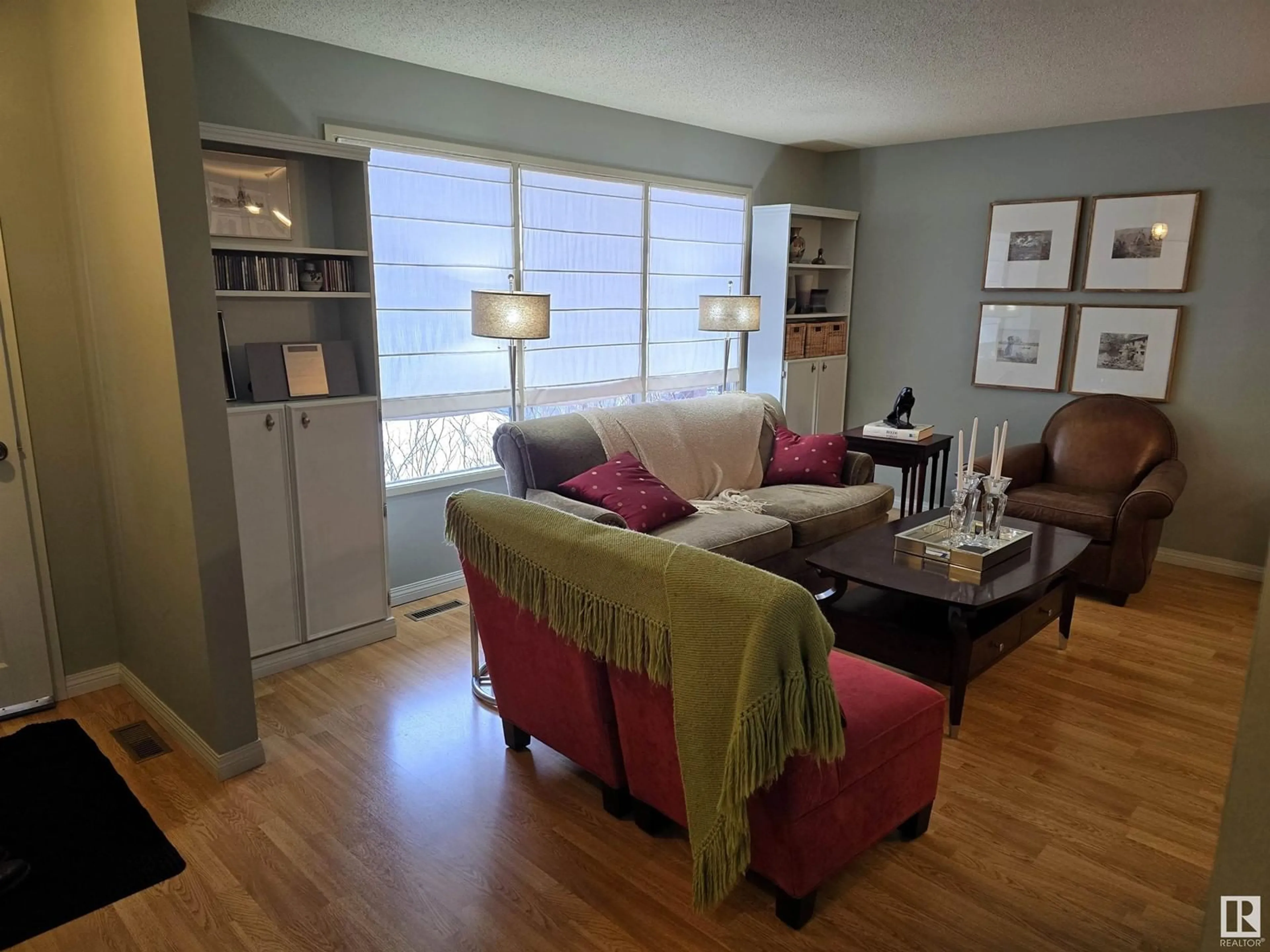 Living room with furniture, wood/laminate floor for 5523 52 A AV, Bon Accord Alberta T0A0K0