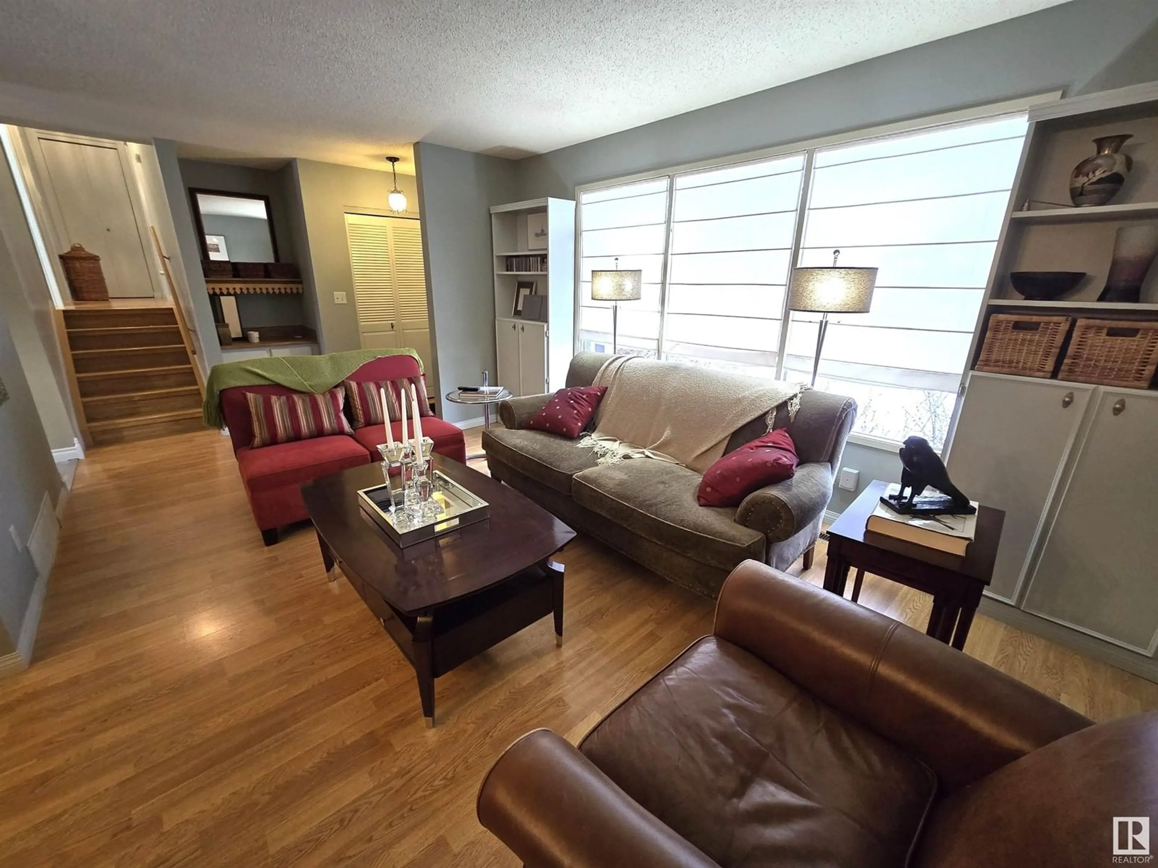 Living room with furniture, wood/laminate floor for 5523 52 A AV, Bon Accord Alberta T0A0K0