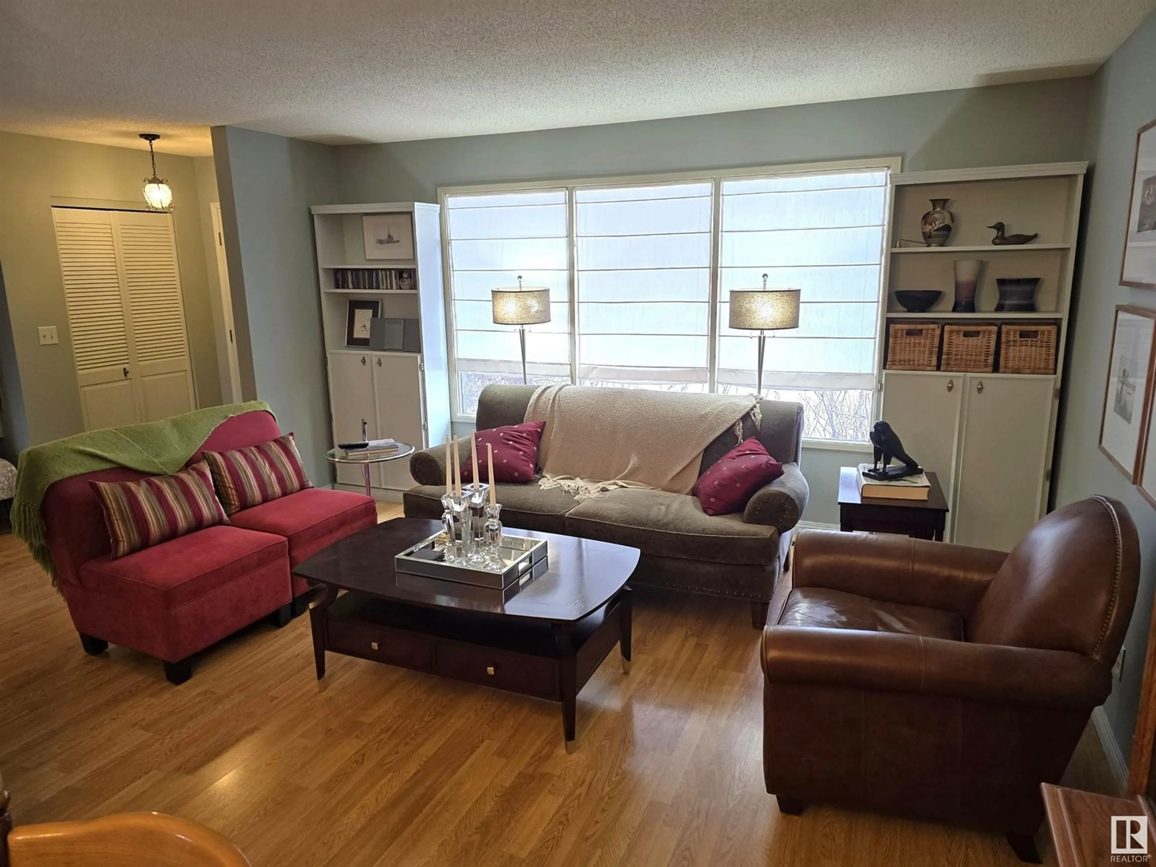 Living room with furniture, wood/laminate floor for 5523 52 A AV, Bon Accord Alberta T0A0K0