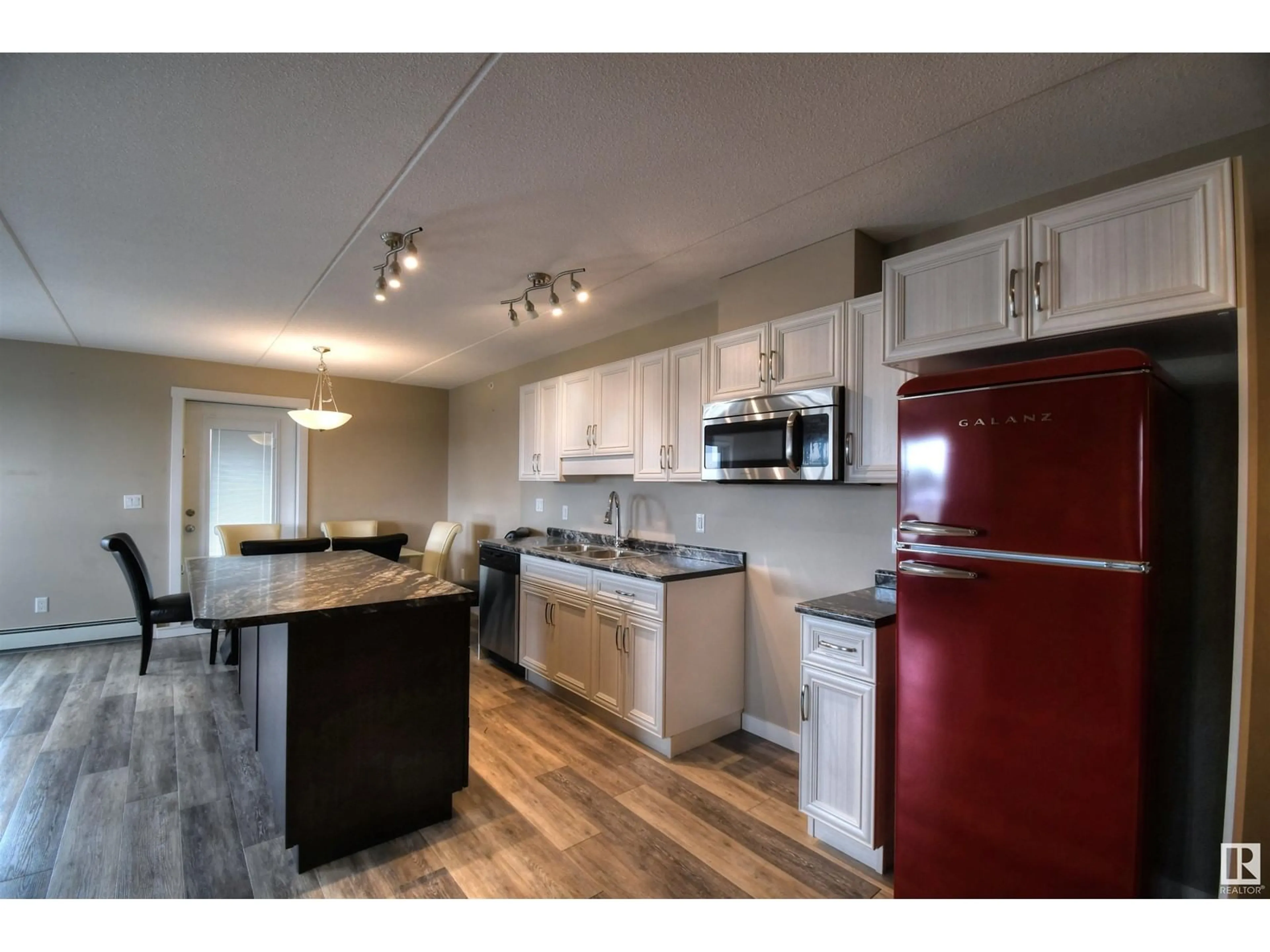 Open concept kitchen, wood/laminate floor for #303 4614B Lakeshore DR, St. Paul Town Alberta T0A3A3