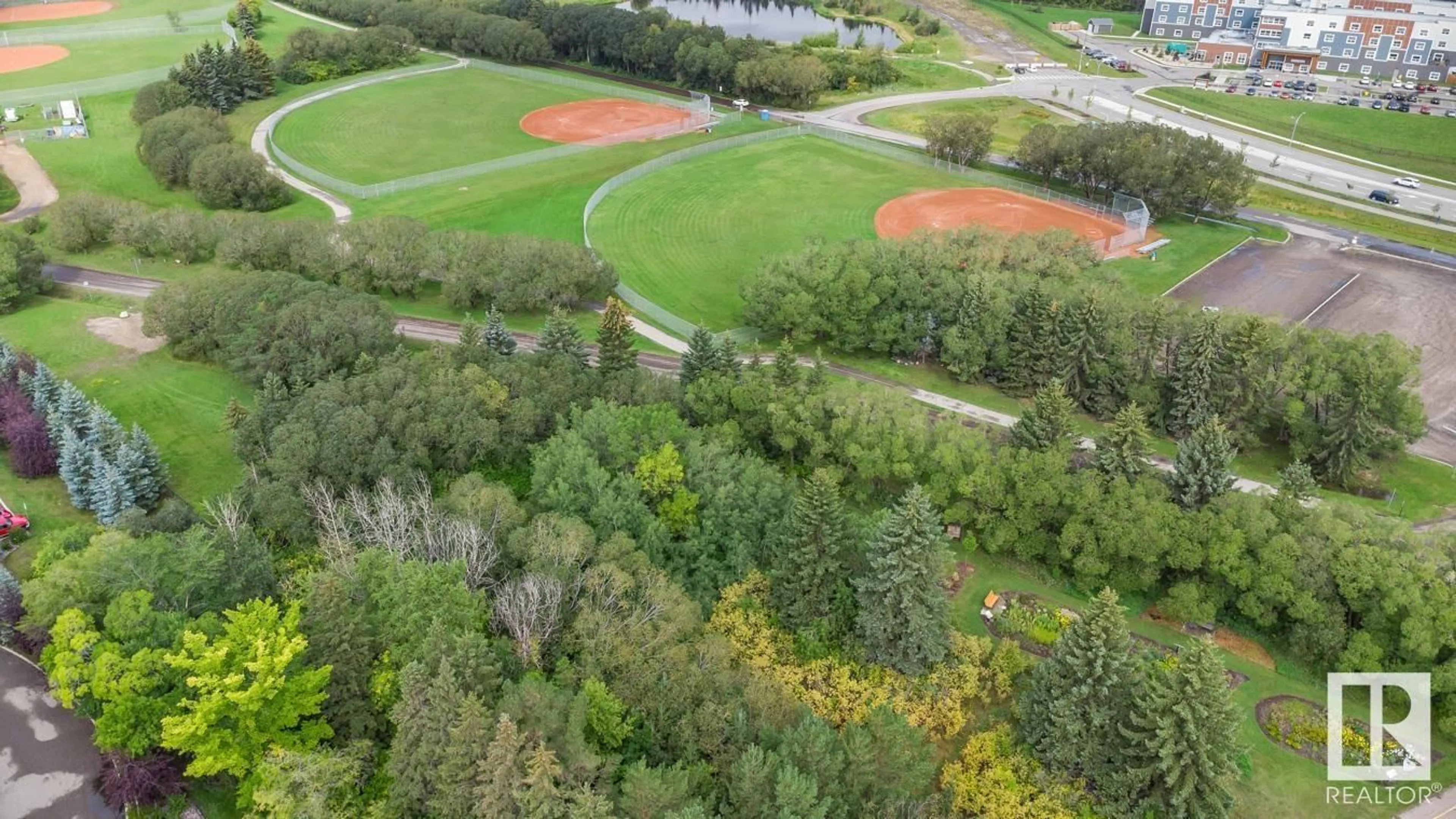 A pic from outside/outdoor area/front of a property/back of a property/a pic from drone, forest/trees view for #401 501 PALISADES WY, Sherwood Park Alberta T8H0H8