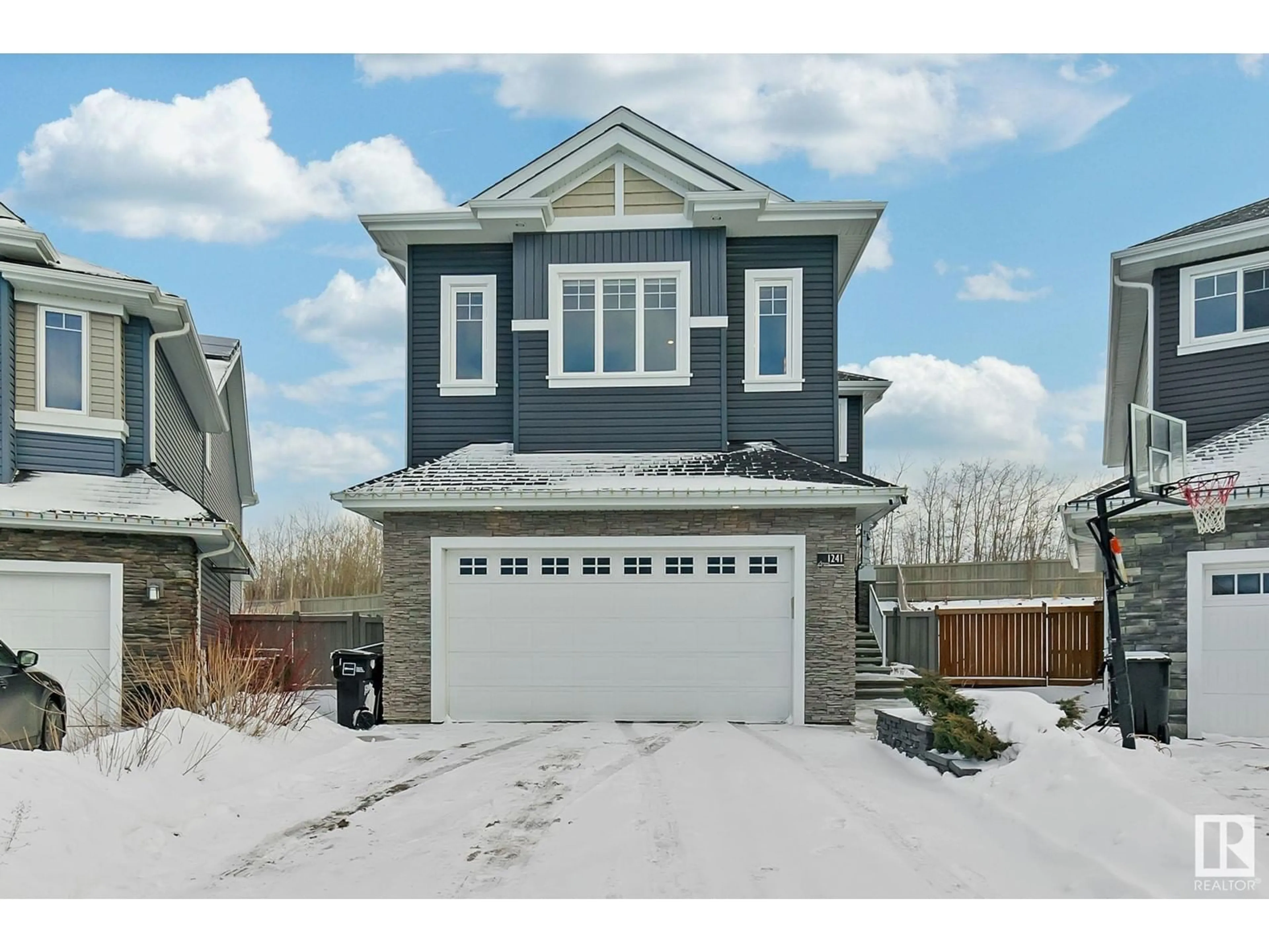 Home with vinyl exterior material, street for 1241 Starling Dr NW, Edmonton Alberta T5S0H8