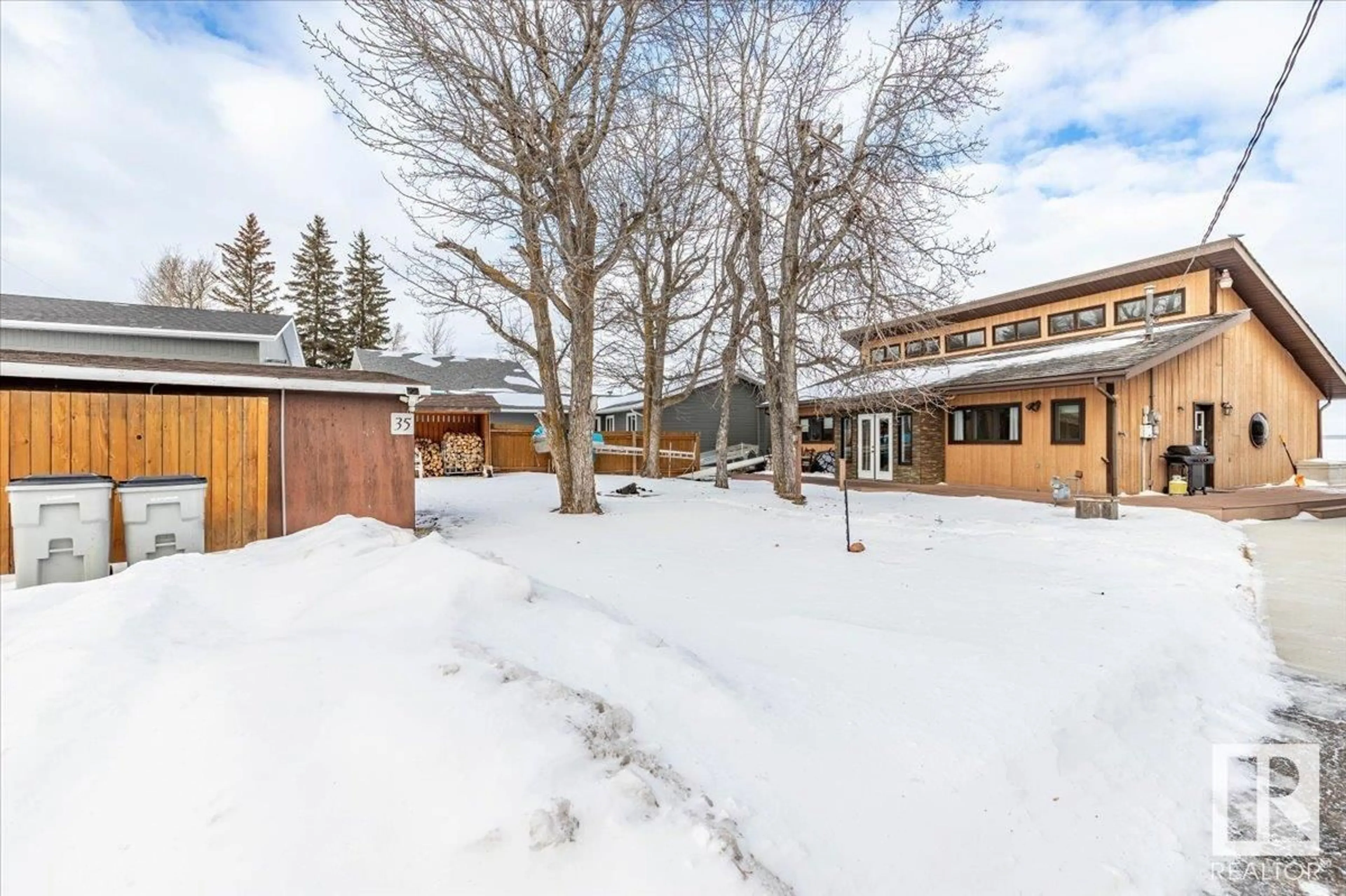 A pic from outside/outdoor area/front of a property/back of a property/a pic from drone, street for 35 LAKESHORE DR, Rural Wetaskiwin County Alberta T0C2V0