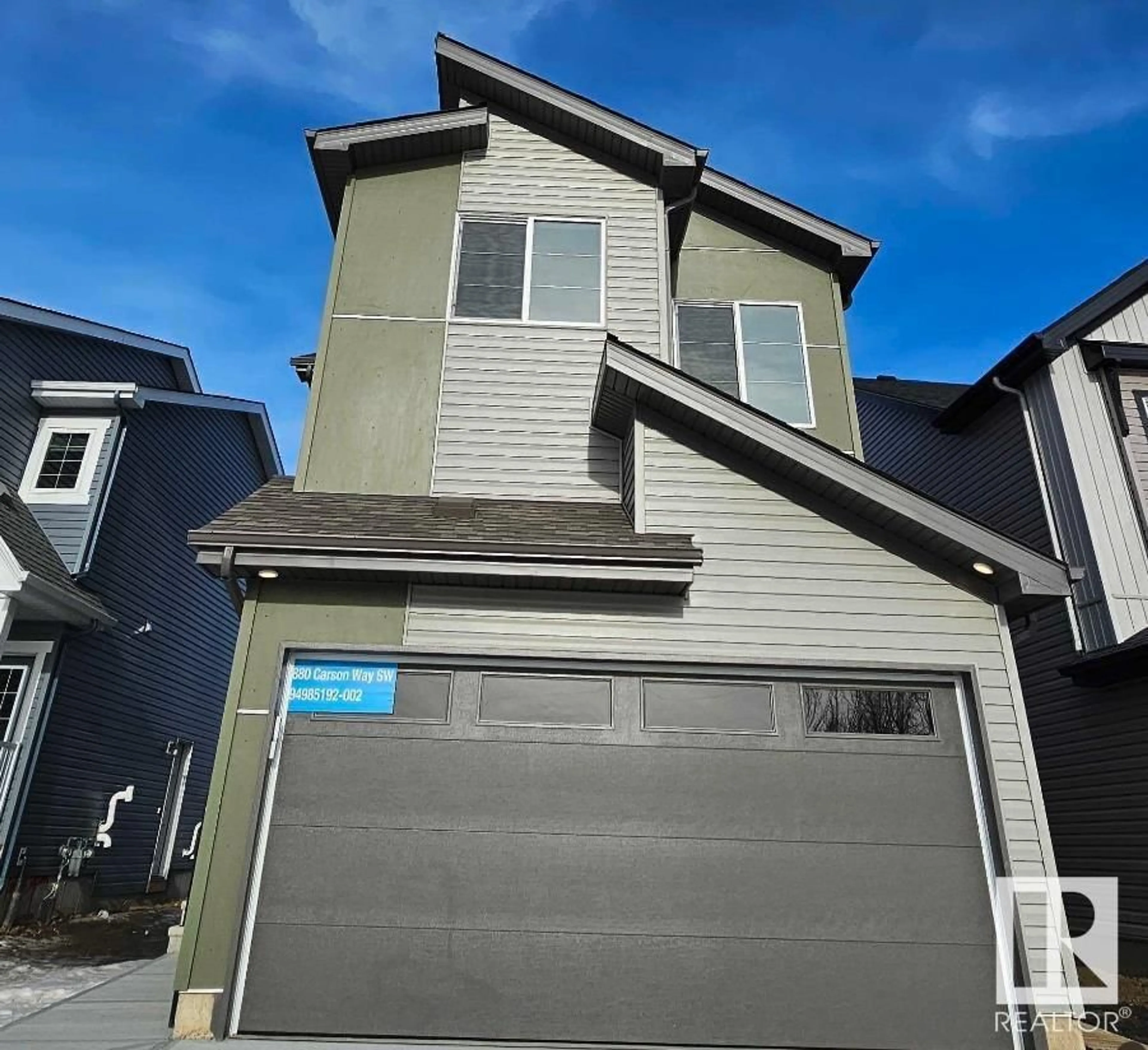 Home with vinyl exterior material, street for 8880 Carson WY SW, Edmonton Alberta T6W5H8