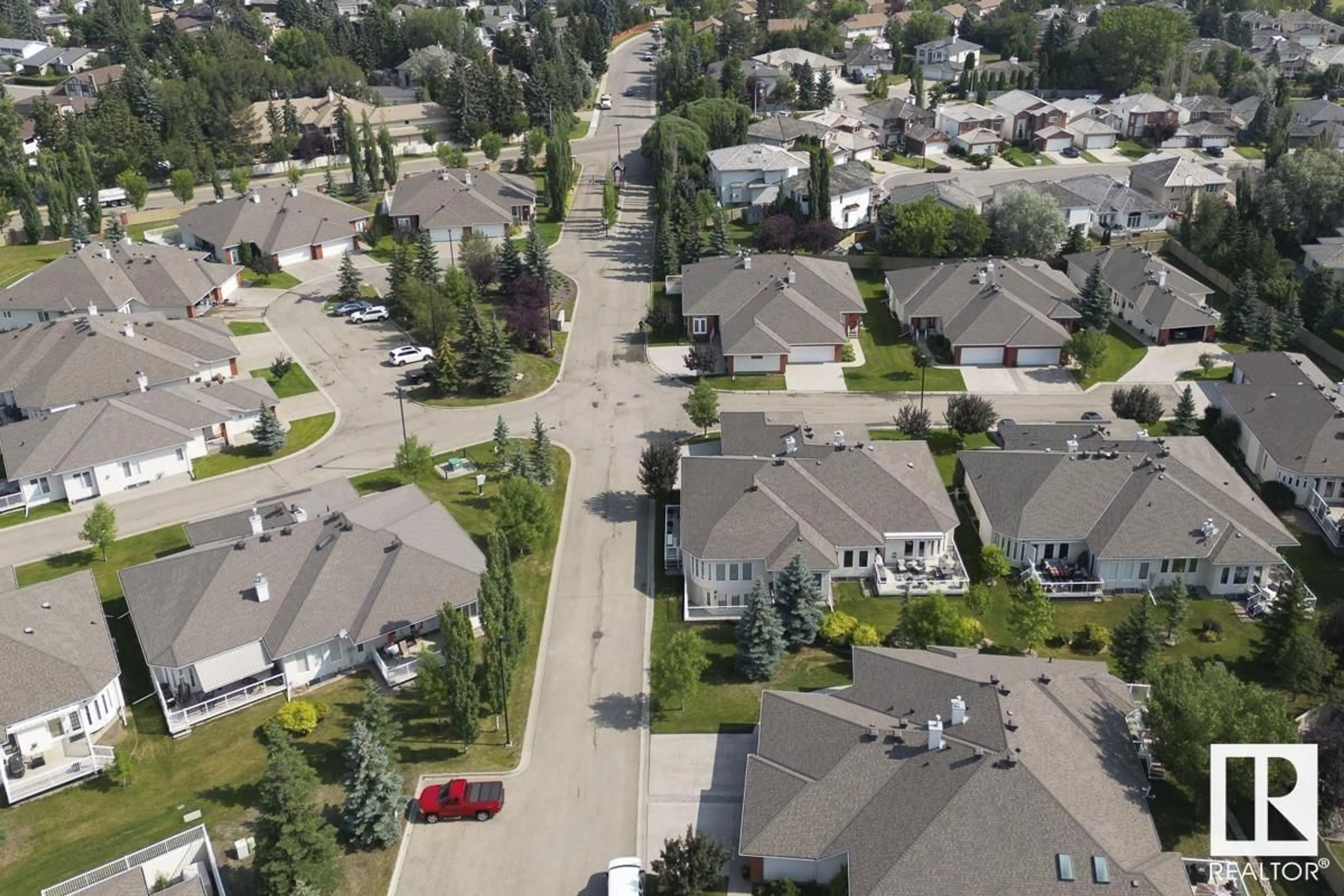 A pic from outside/outdoor area/front of a property/back of a property/a pic from drone, street for #20 1225 WANYANDI RD NW, Edmonton Alberta T6M2W7