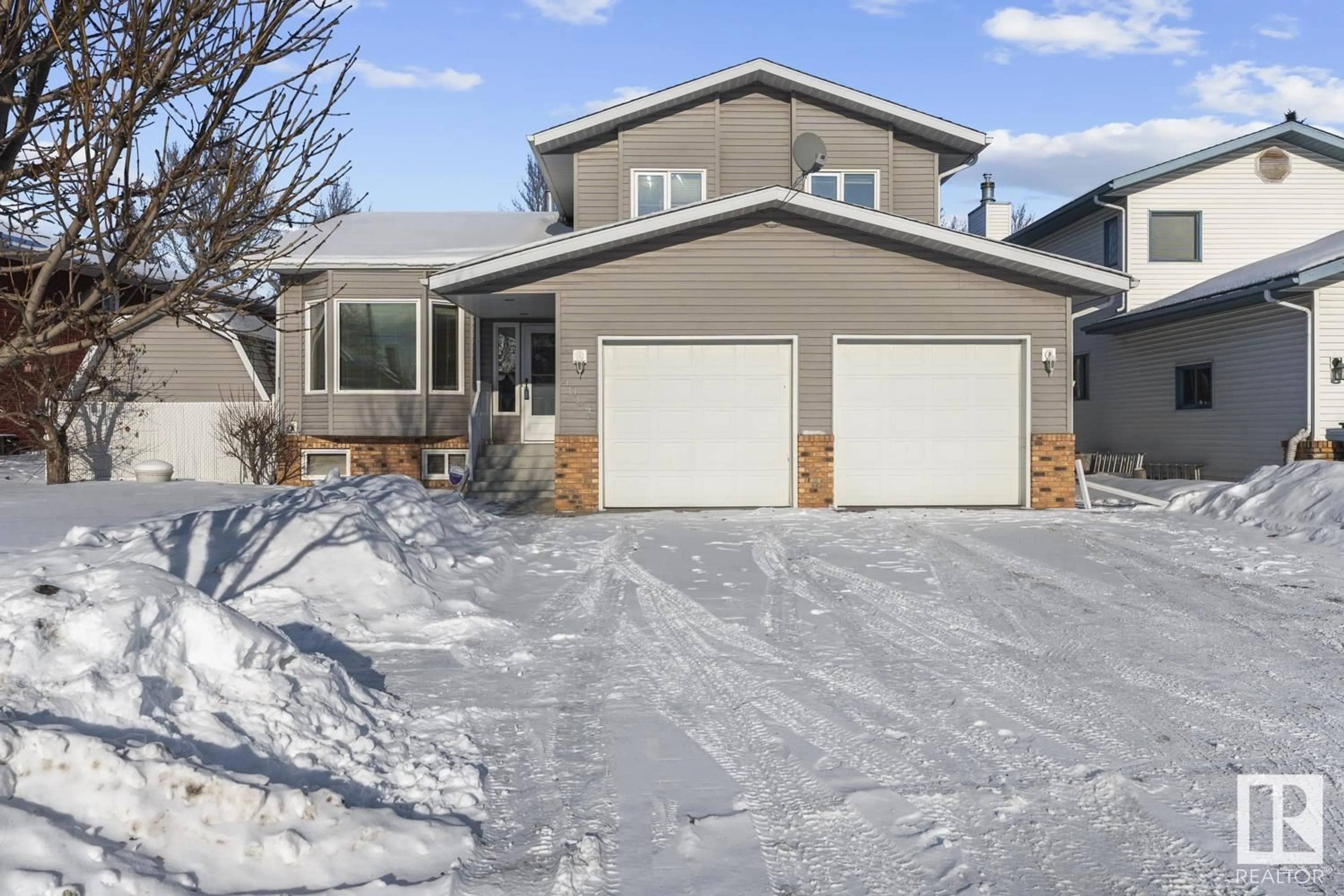 Home with vinyl exterior material, street for 4003 41 AV, Bonnyville Town Alberta T9N1T3