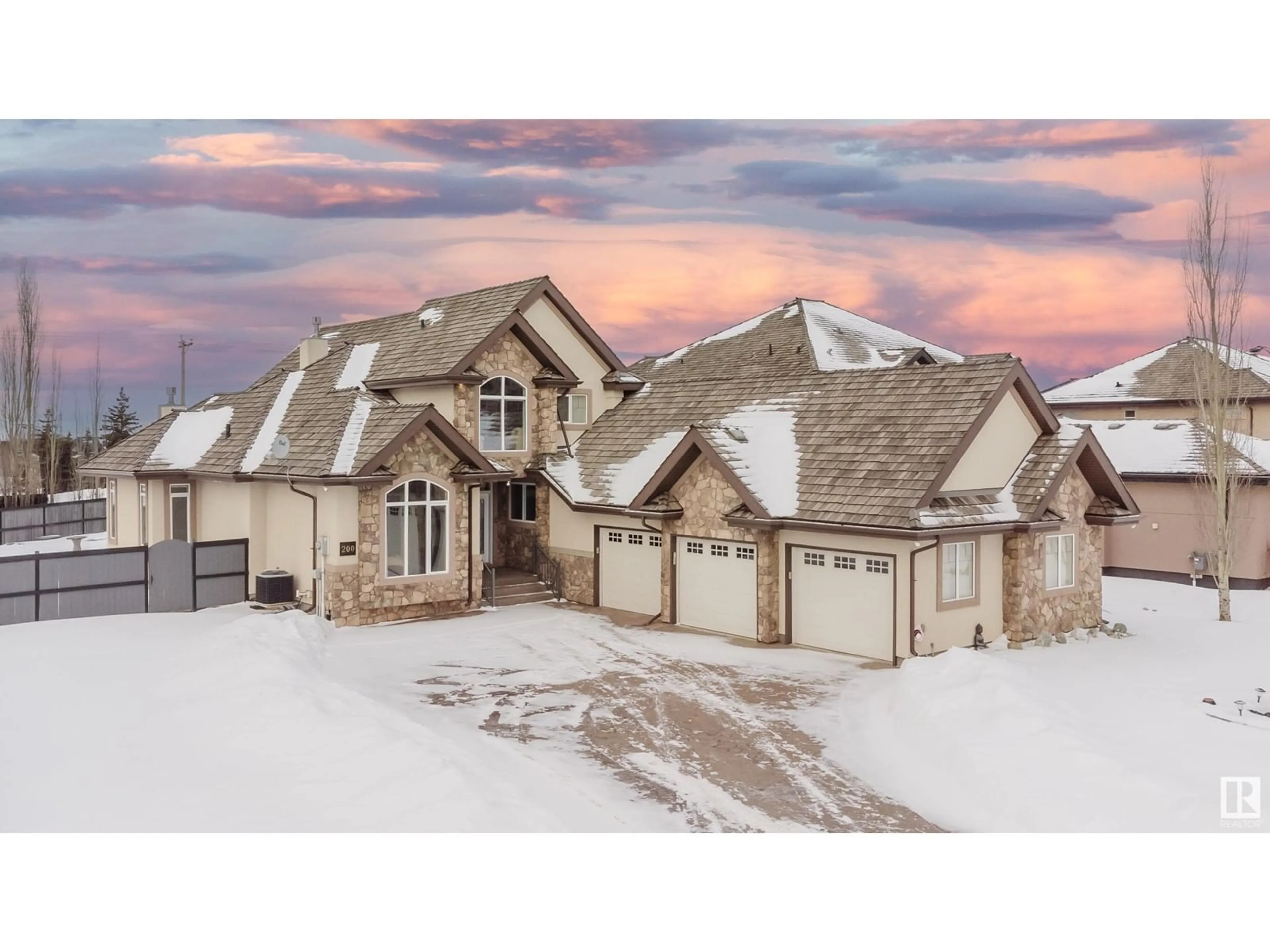 A pic from outside/outdoor area/front of a property/back of a property/a pic from drone, street for 200 - 52327 233 RGE RD, Rural Strathcona County Alberta T8B1C6