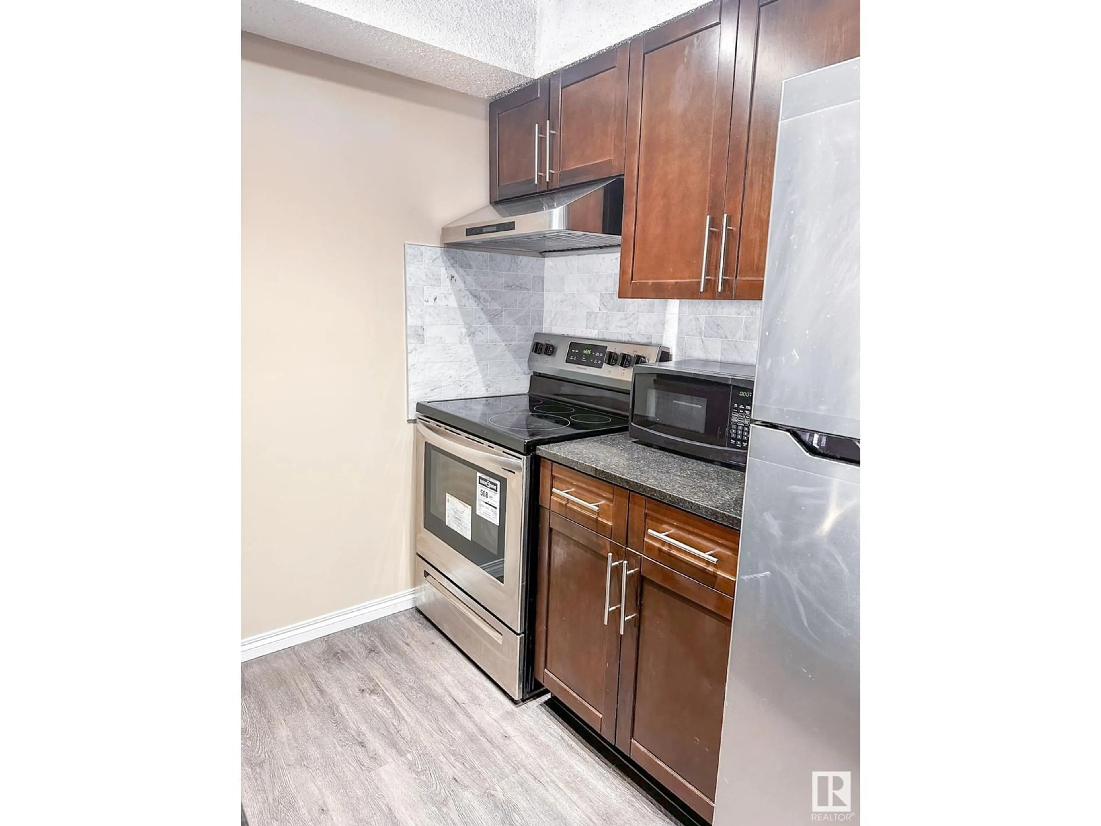 Standard kitchen, wood/laminate floor for #215 11808 22 Ave SW SW, Edmonton Alberta T6W2A2