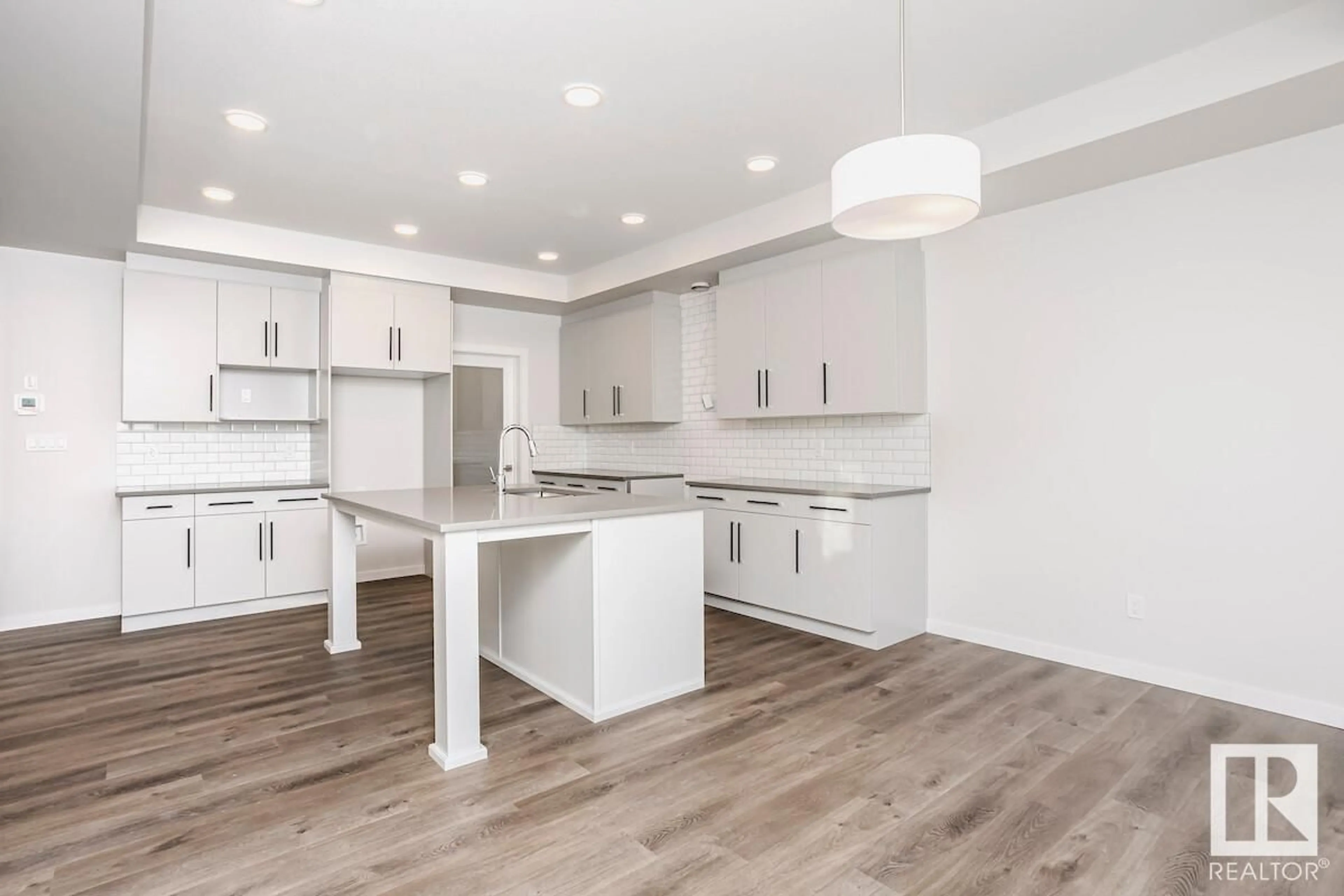 Open concept kitchen, wood/laminate floor for 19 ASHBURY CR, Spruce Grove Alberta T7X3C6