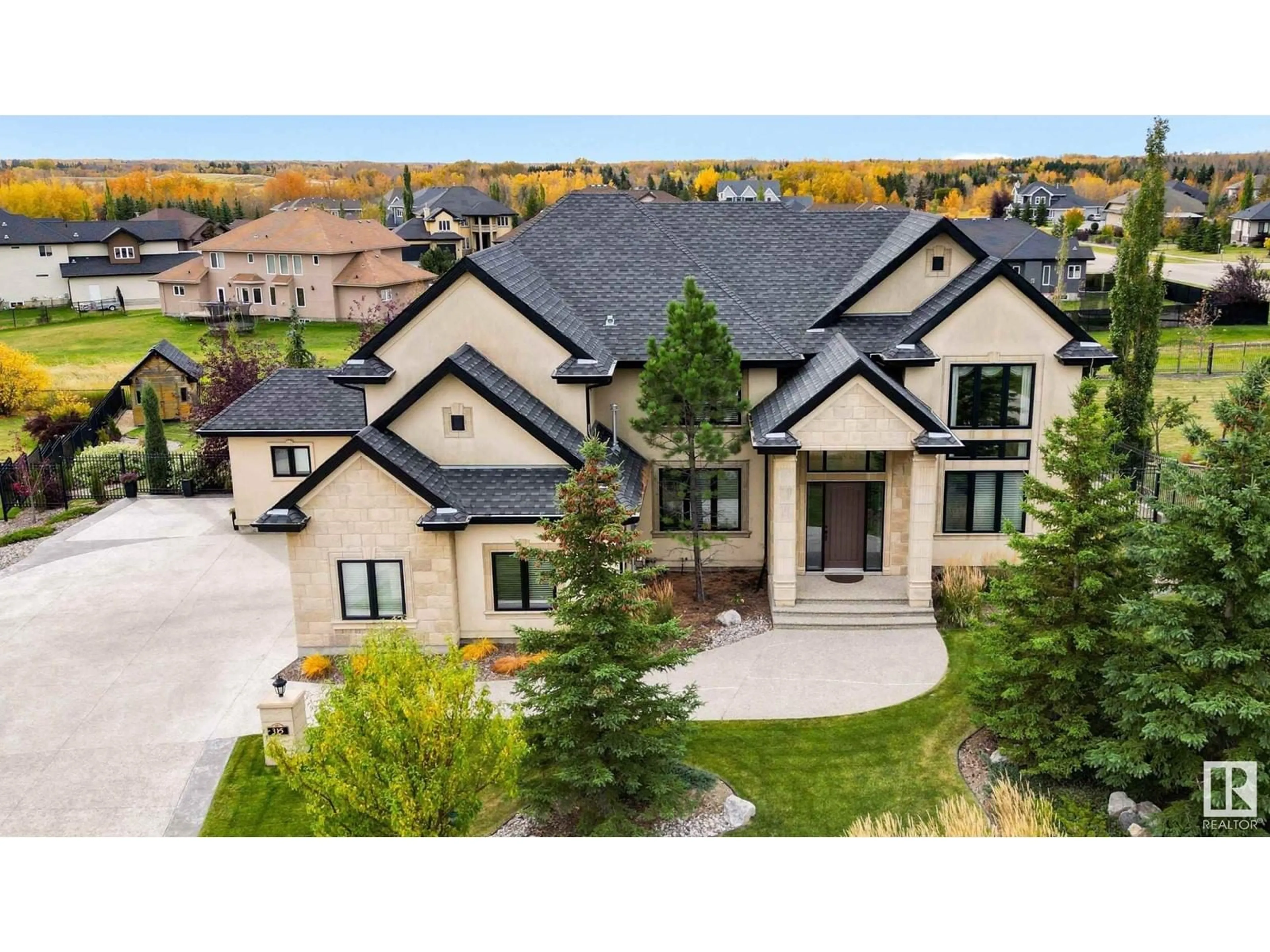 A pic from outside/outdoor area/front of a property/back of a property/a pic from drone, mountain view for #315 23033 WYE RD, Rural Strathcona County Alberta T8B1H9