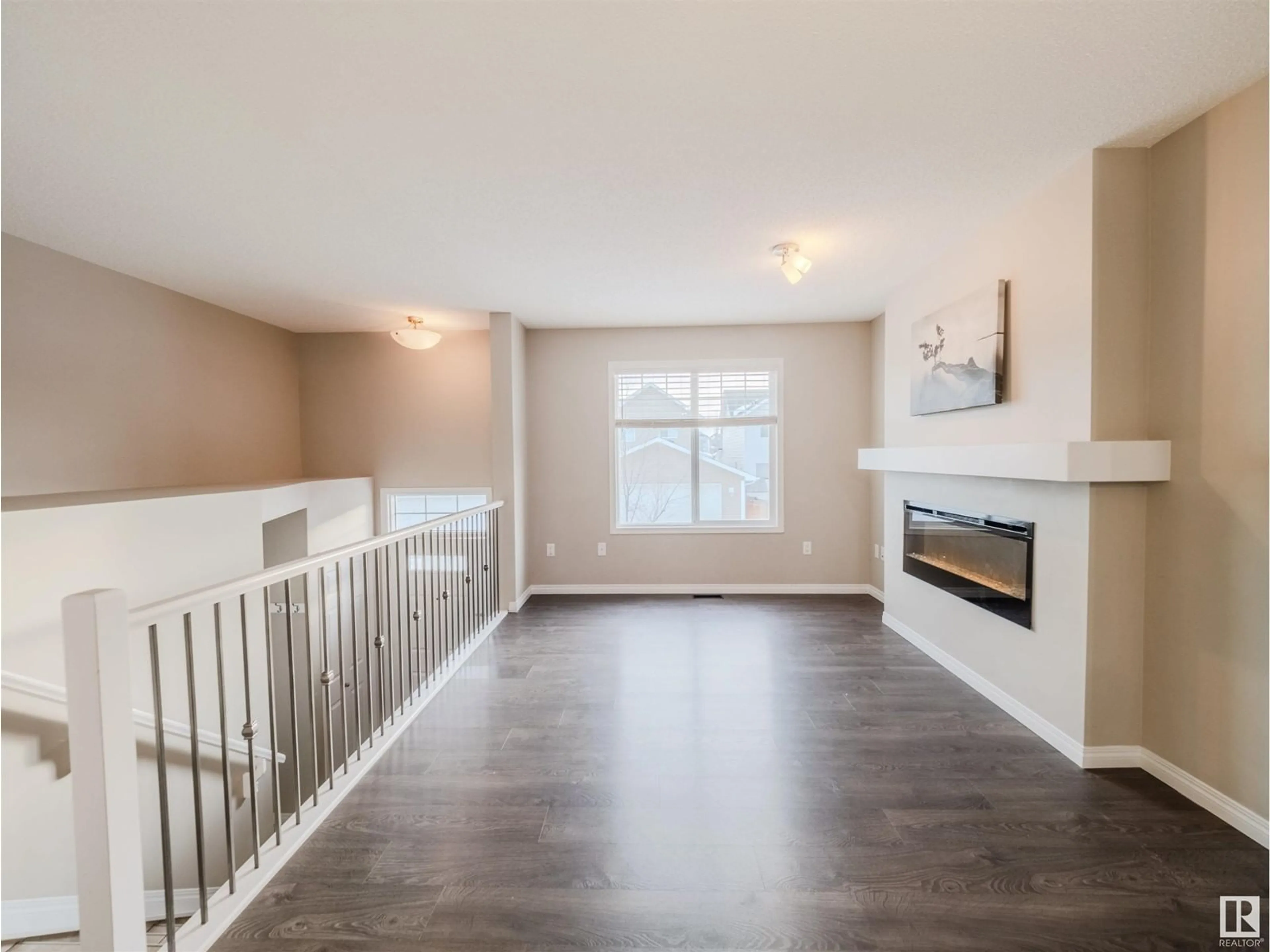 Living room with furniture, wood/laminate floor for #37 4050 SAVARYN DR SW, Edmonton Alberta T6X1R8