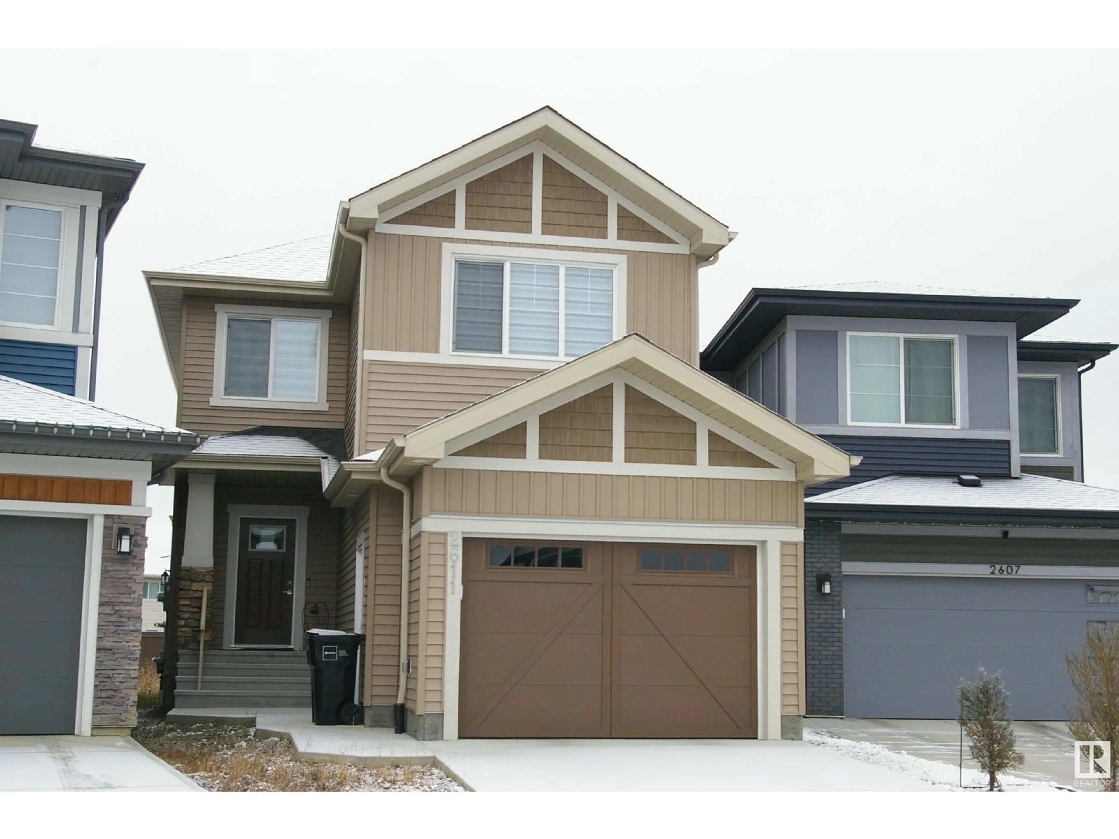 Home with vinyl exterior material, street for 2611 200 ST NW, Edmonton Alberta T6M1K3