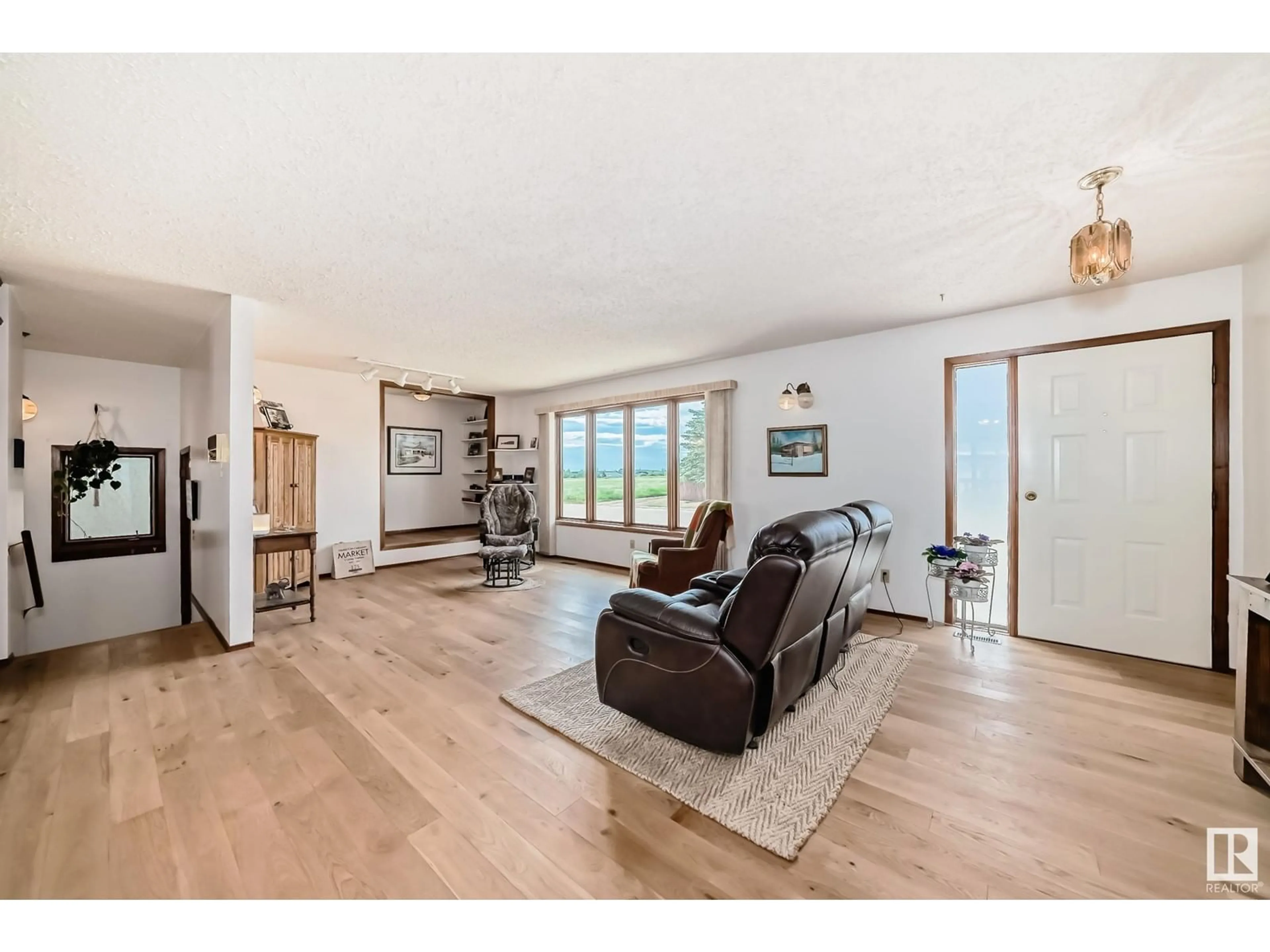 Living room with furniture, wood/laminate floor for 10339 111 AV, Westlock Alberta T7P1E6