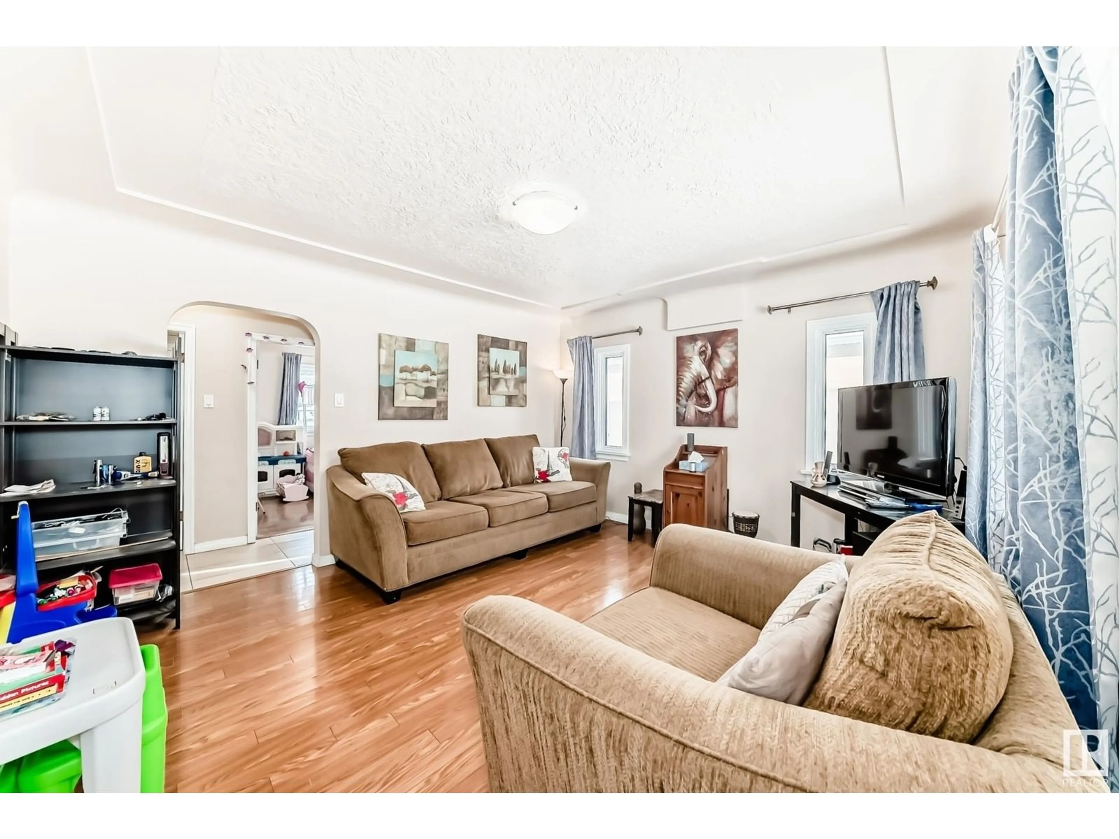 Living room with furniture, wood/laminate floor for 12340 89 ST NW, Edmonton Alberta T5B3W7