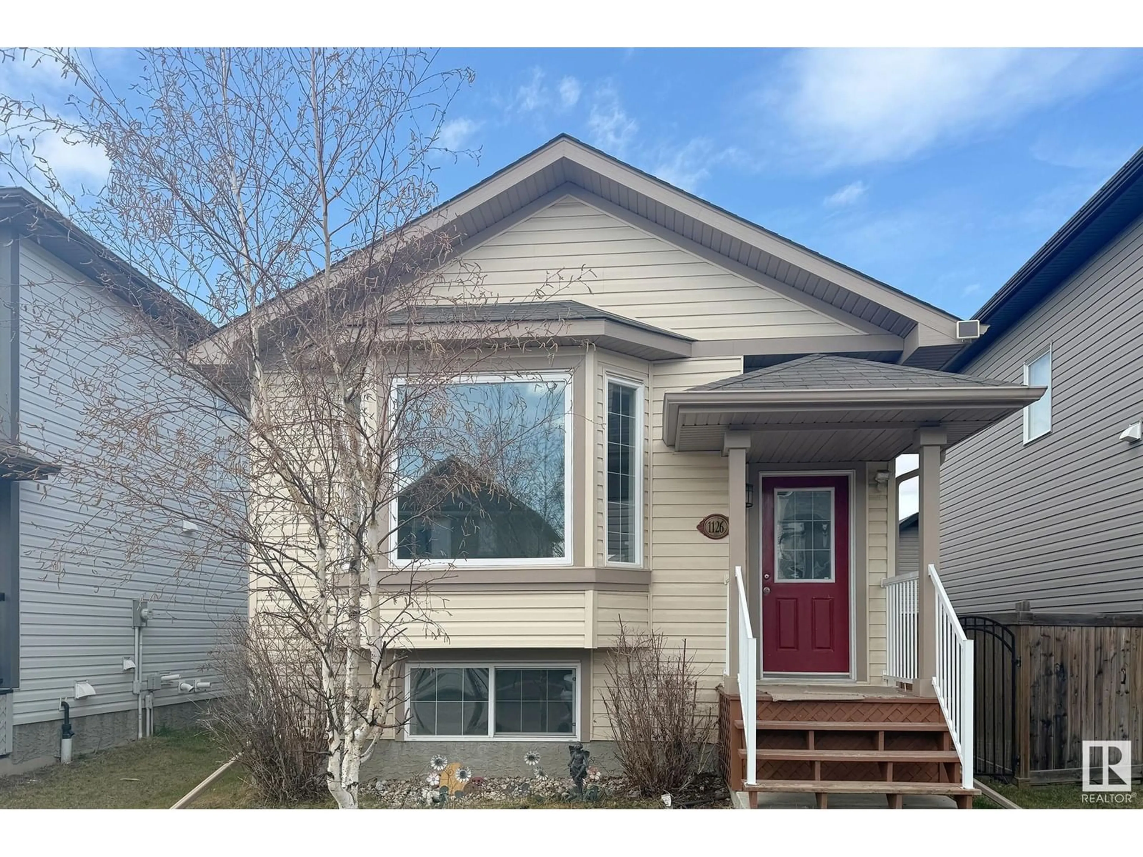 Home with vinyl exterior material, street for 1126 36A AV NW, Edmonton Alberta T6T0G1