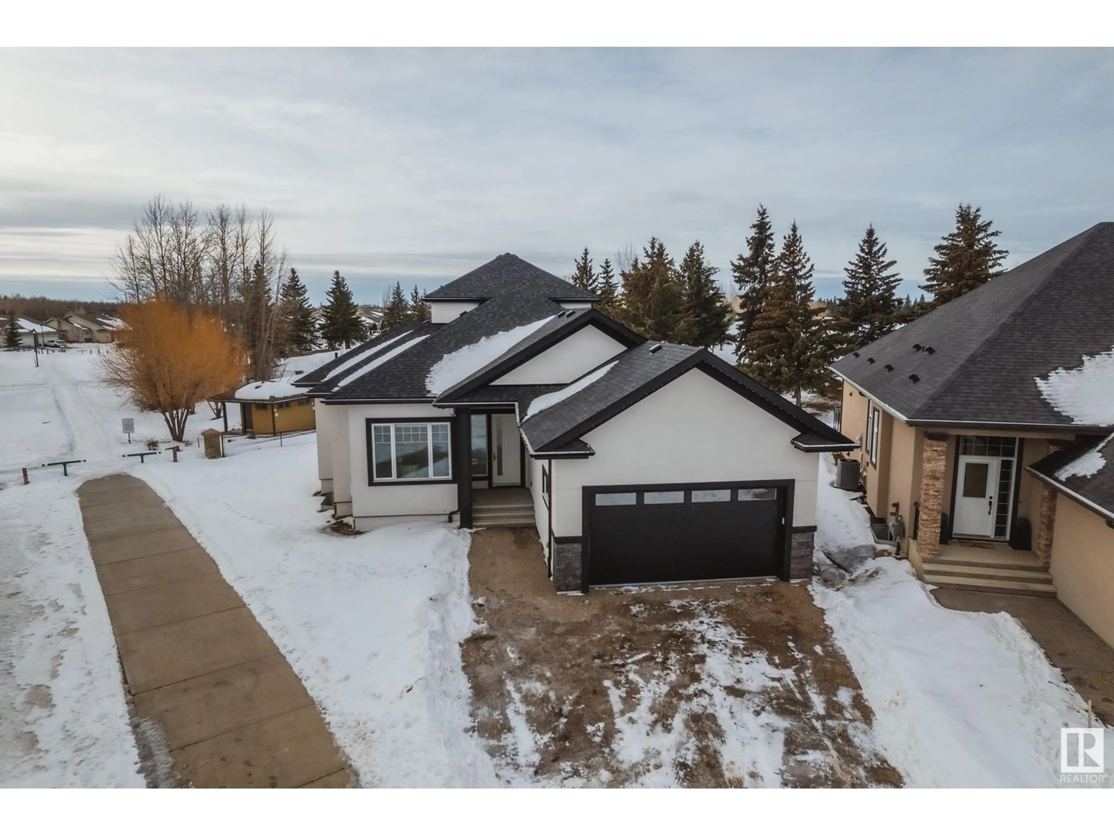 A pic from outside/outdoor area/front of a property/back of a property/a pic from drone, street for #7 20425 93 AV NW, Edmonton Alberta T5T7C7