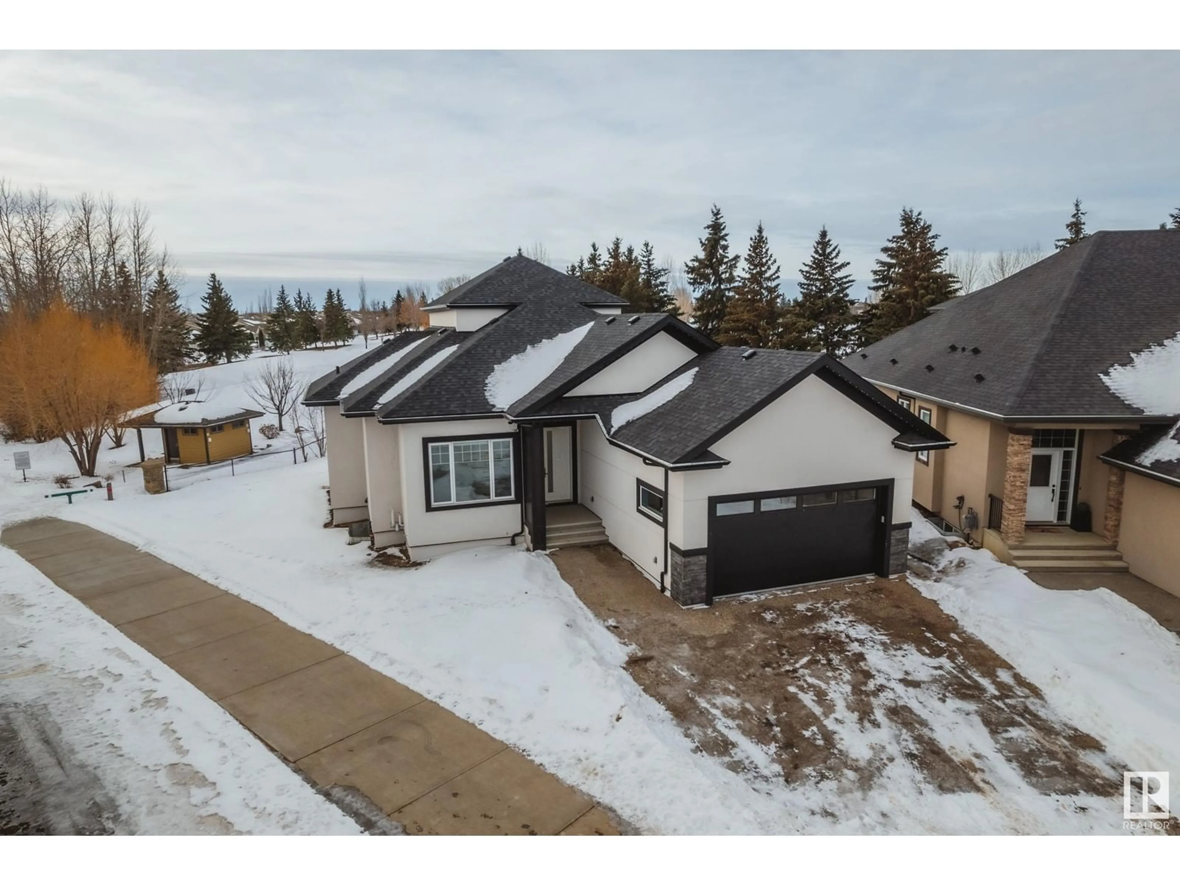 A pic from outside/outdoor area/front of a property/back of a property/a pic from drone, street for #7 20425 93 AV NW, Edmonton Alberta T5T7C7