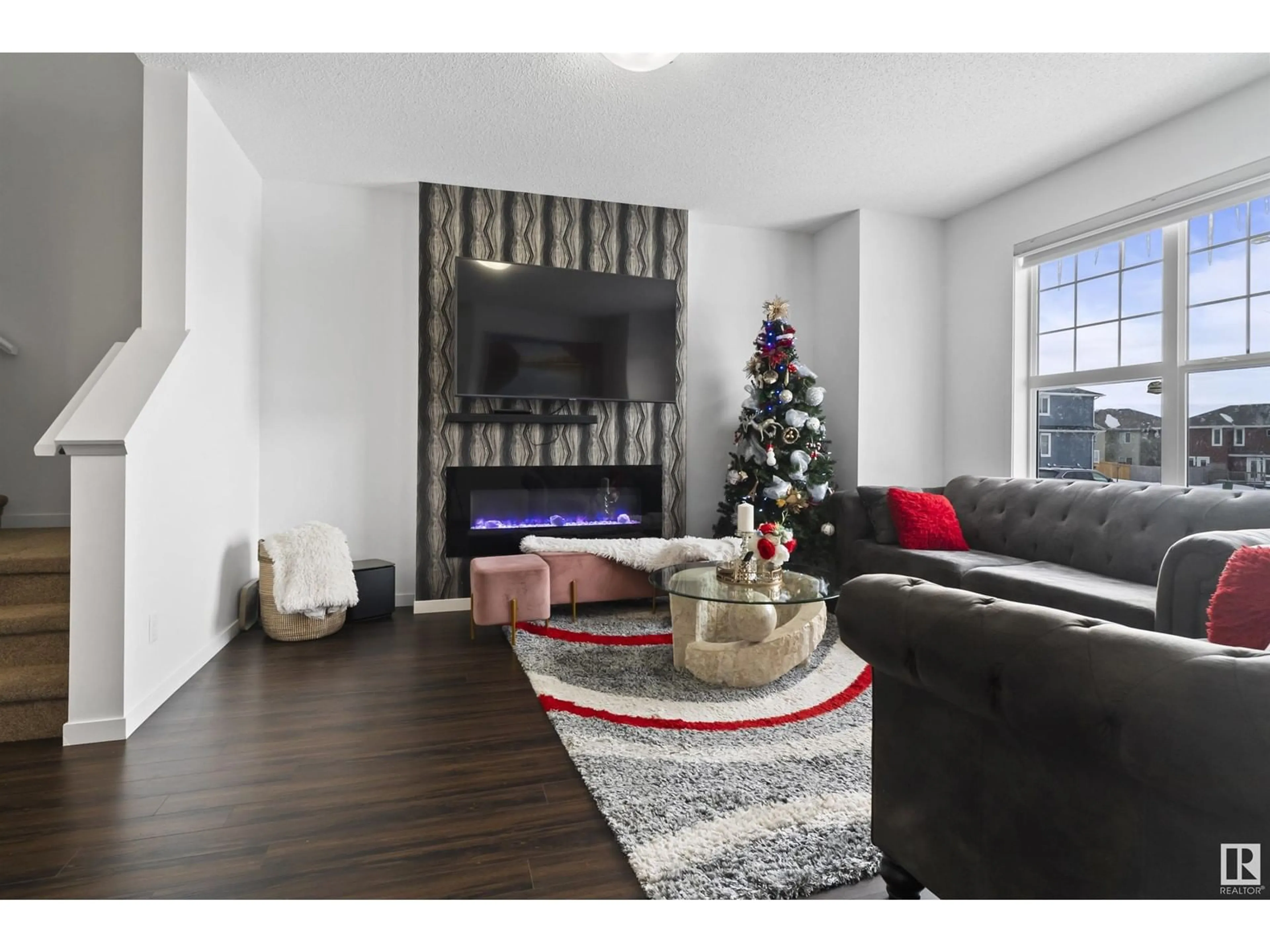 Living room with furniture, wood/laminate floor for 2031 52 ST SW SW, Edmonton Alberta T6X1Z7