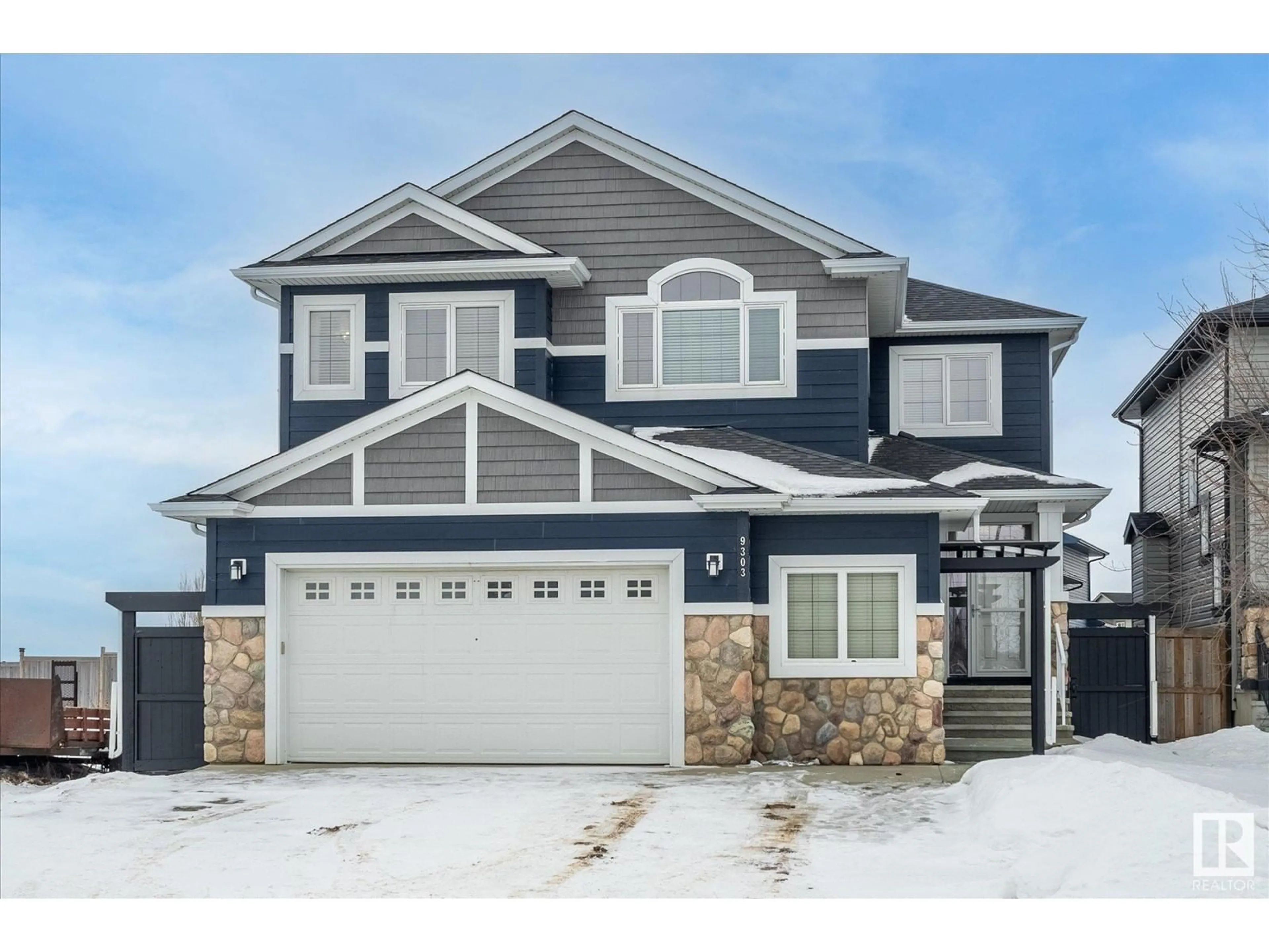 Home with vinyl exterior material, street for 9303 84 AV, Morinville Alberta T8R0A7