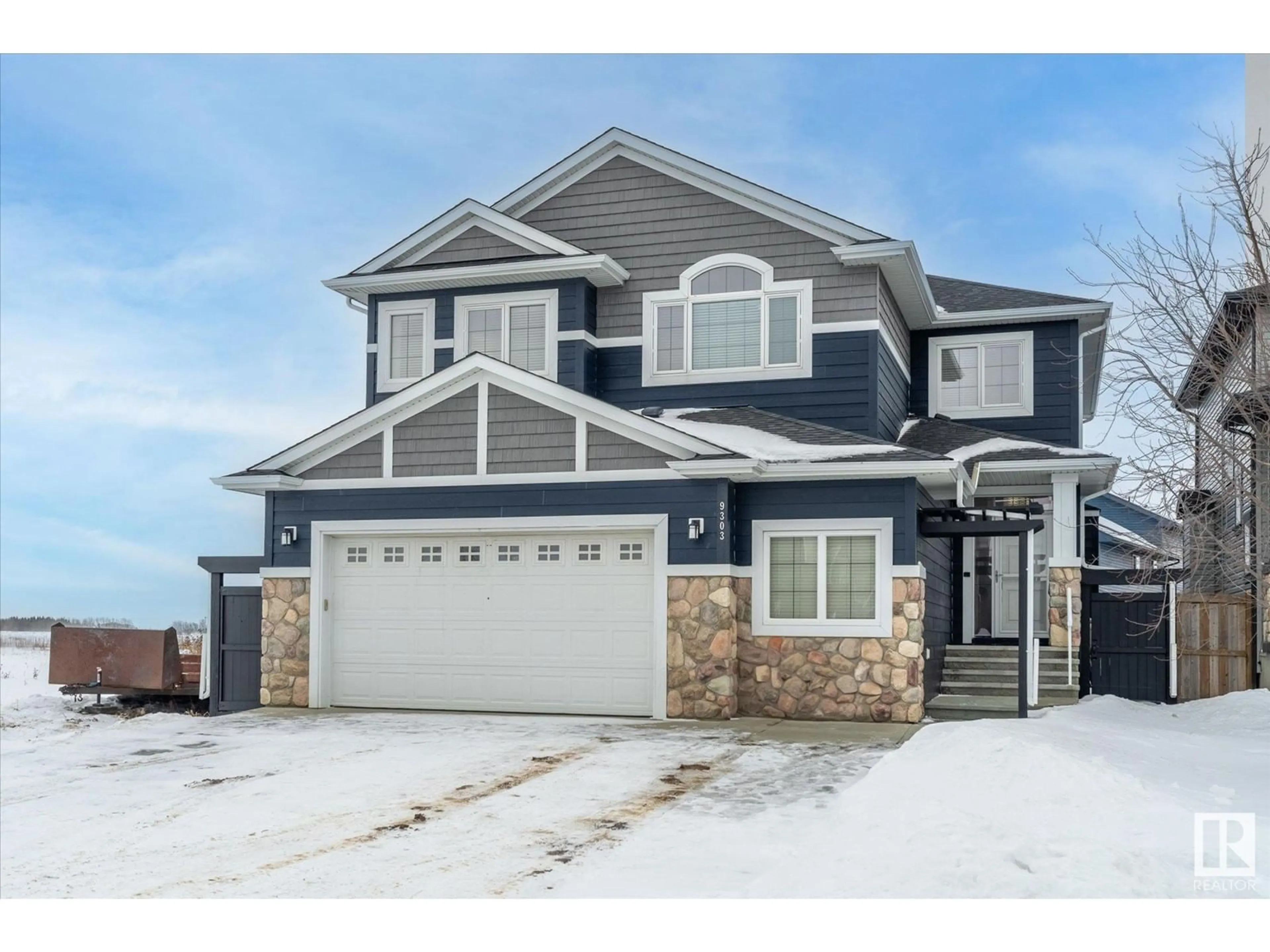 Home with vinyl exterior material, street for 9303 84 AV, Morinville Alberta T8R0A7