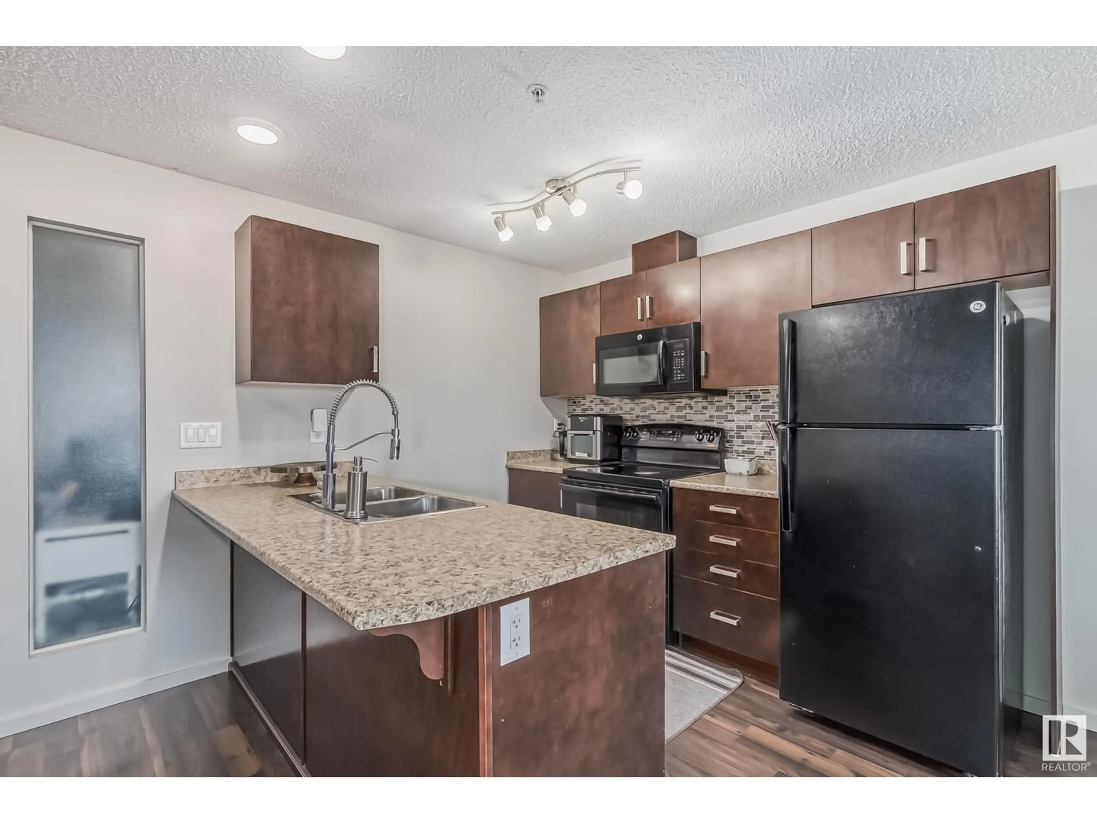 Standard kitchen, wood/laminate floor for #331 5515 7 AV SW, Edmonton Alberta T6X2A8