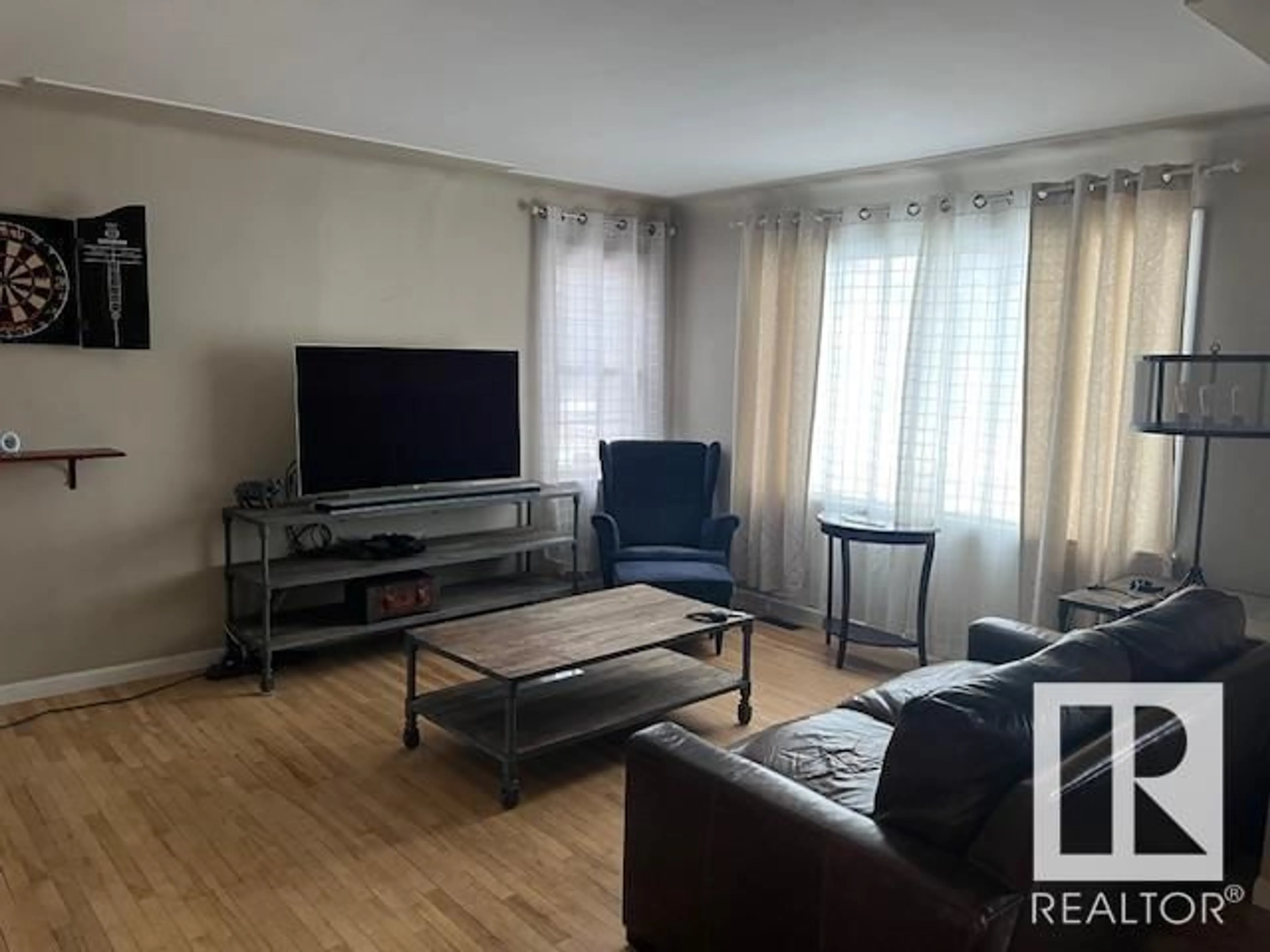 Living room with furniture, unknown for 10933 74 AV NW, Edmonton Alberta T6G0S5