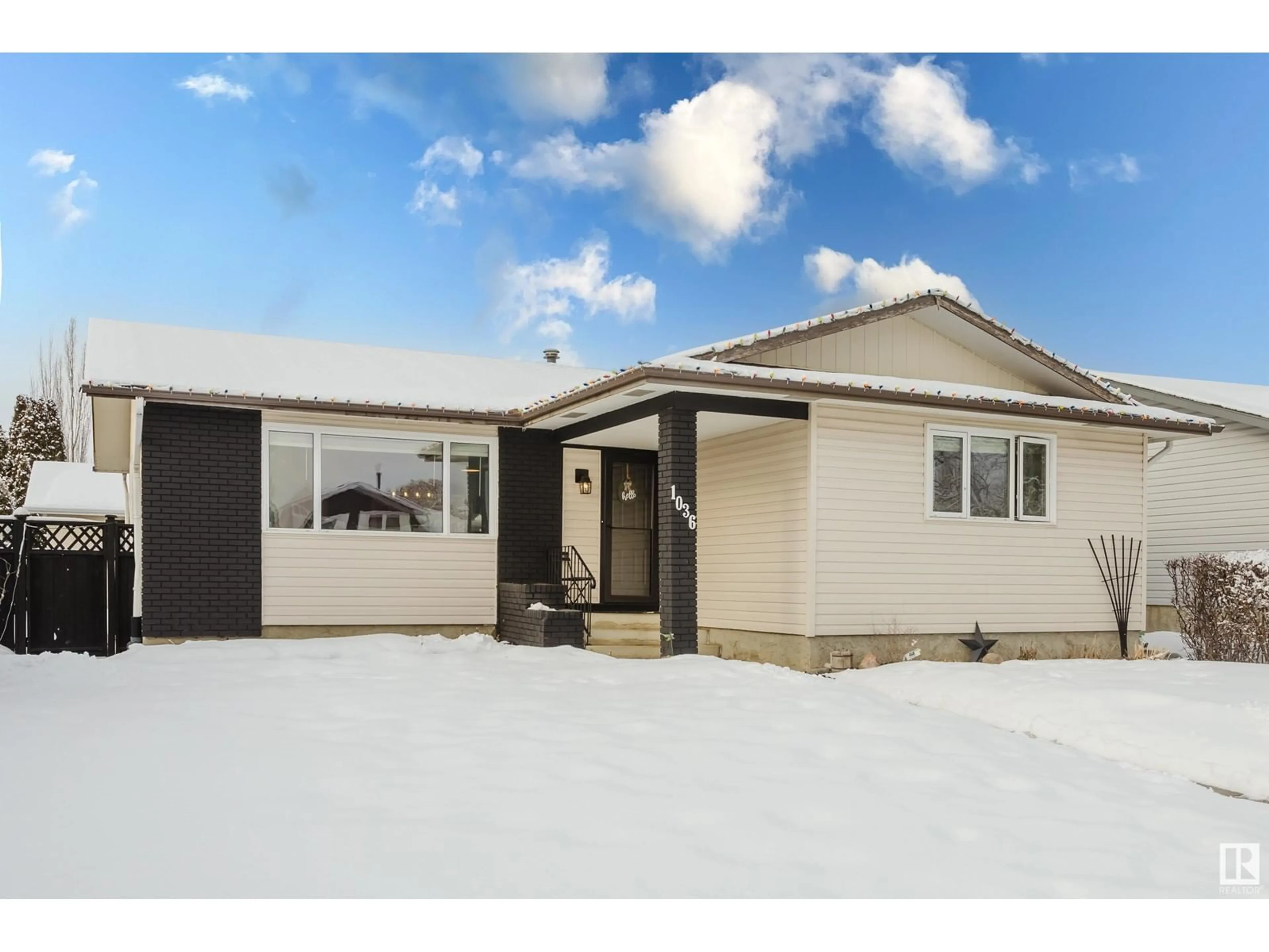 Home with vinyl exterior material, street for 1036 77 ST NW, Edmonton Alberta T6K2R8