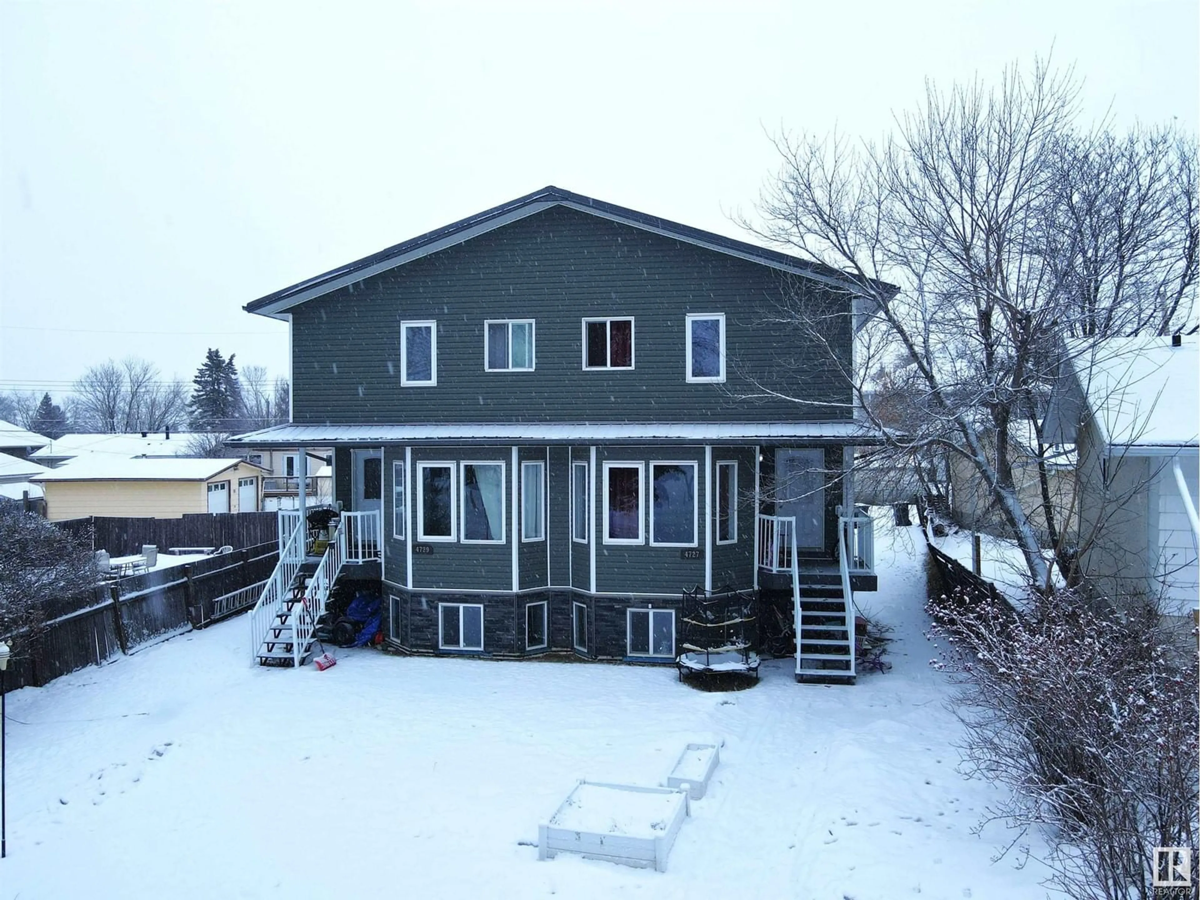 A pic from outside/outdoor area/front of a property/back of a property/a pic from drone, building for 4727 & 4729 47A AV, Drayton Valley Alberta T7A1H9