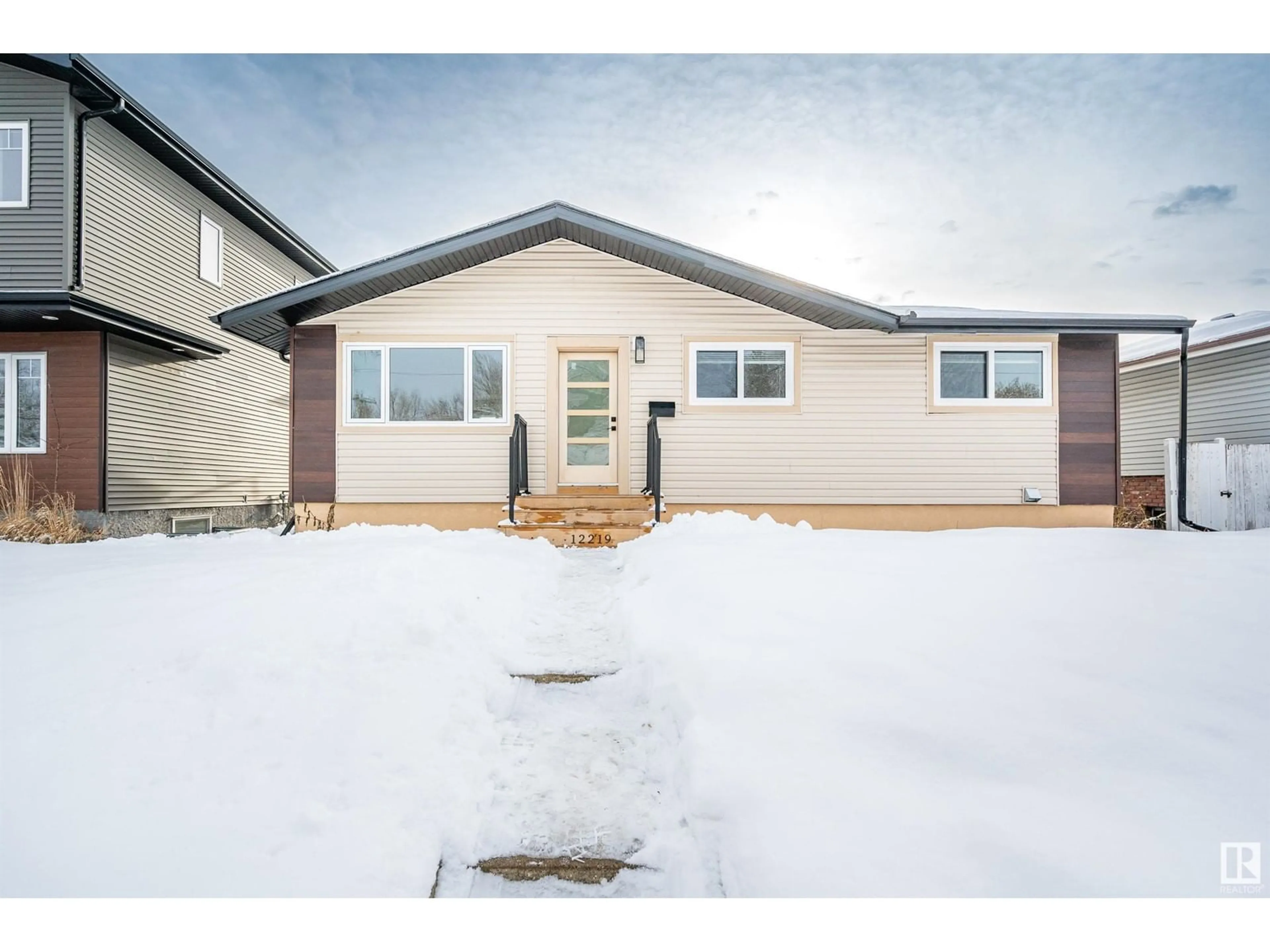 Home with vinyl exterior material, street for 12219 132 AV NW, Edmonton Alberta T5L3P5