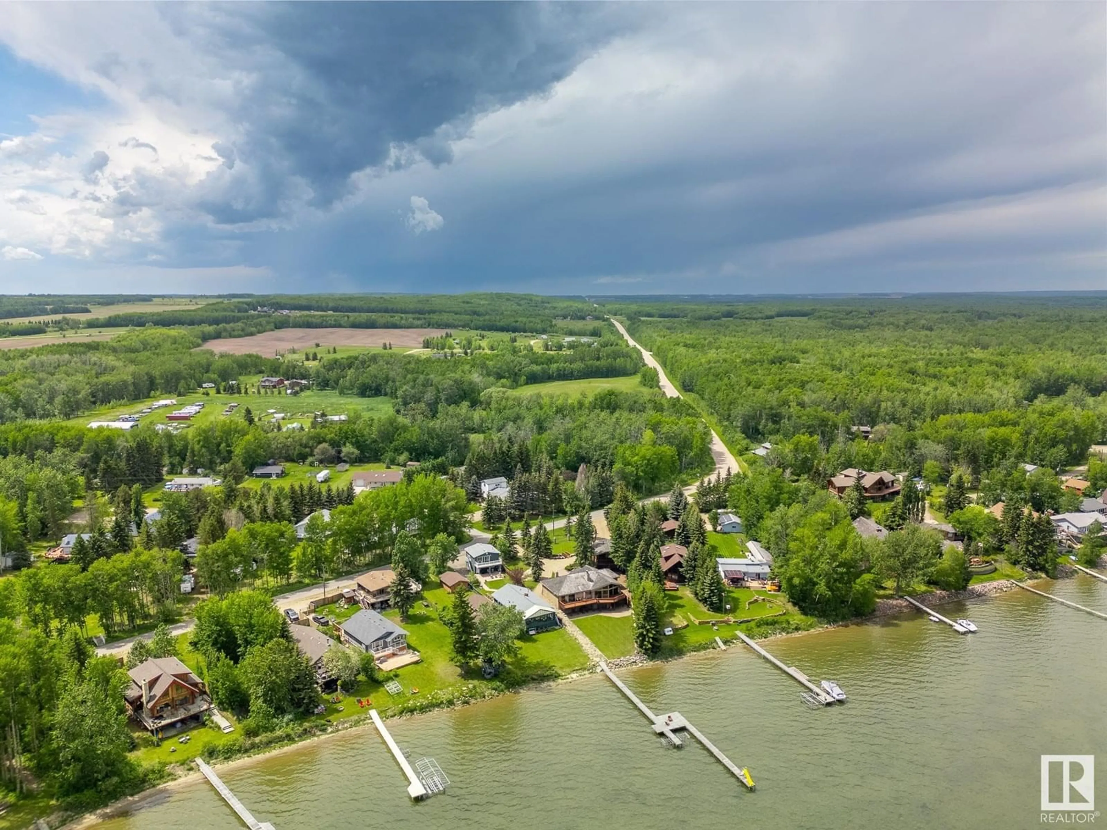 A pic from outside/outdoor area/front of a property/back of a property/a pic from drone, water/lake/river/ocean view for 531 Poplar Bay, Rural Wetaskiwin County Alberta T0C2V0